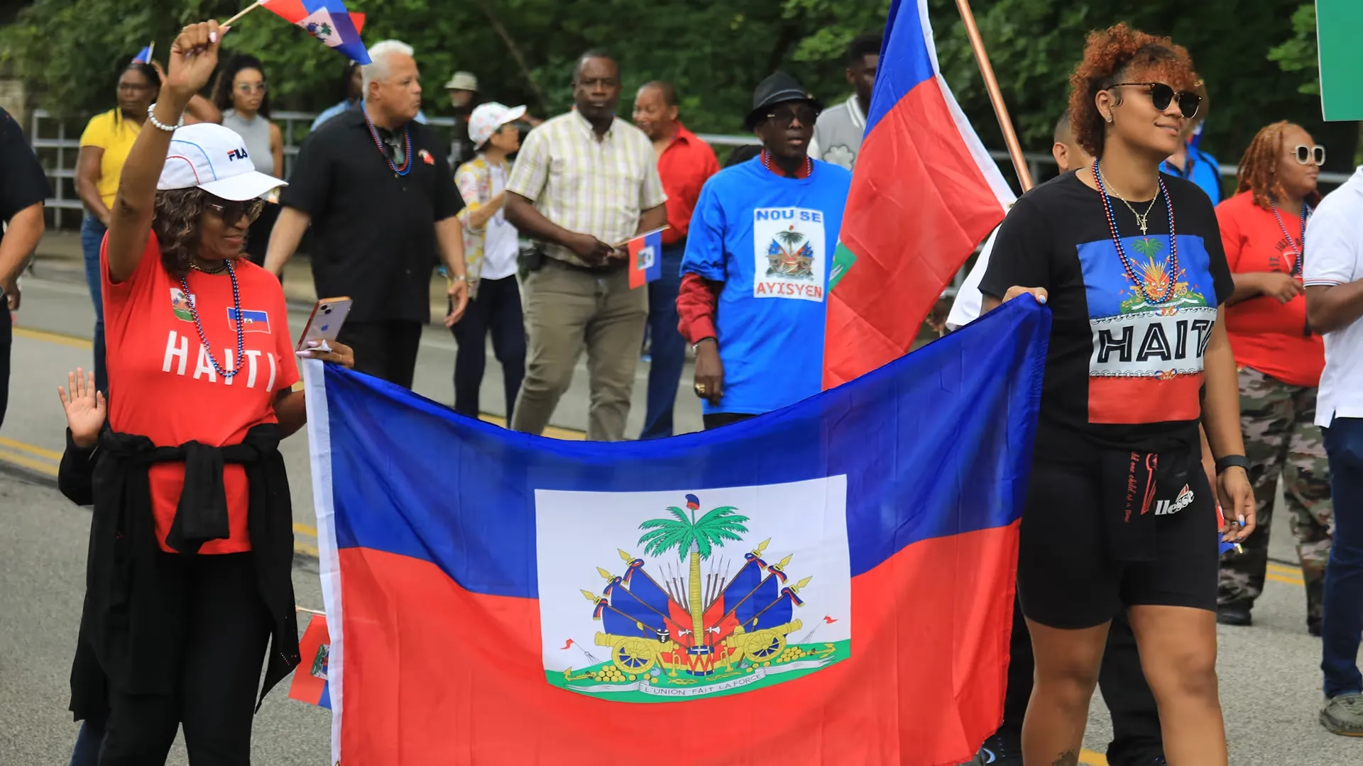People marching with Haitian flag