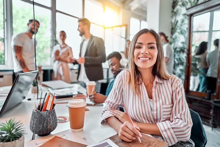 Smiling employee in conference room