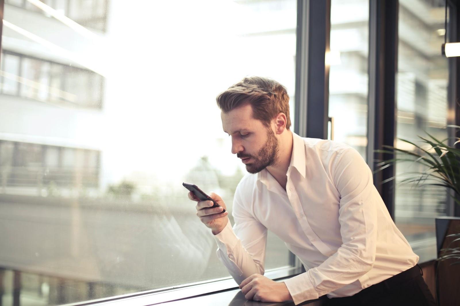 immigration lawyer checking his case status on his mobile phone