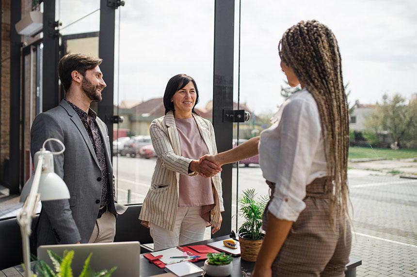 Lawyers shaking hands with clients