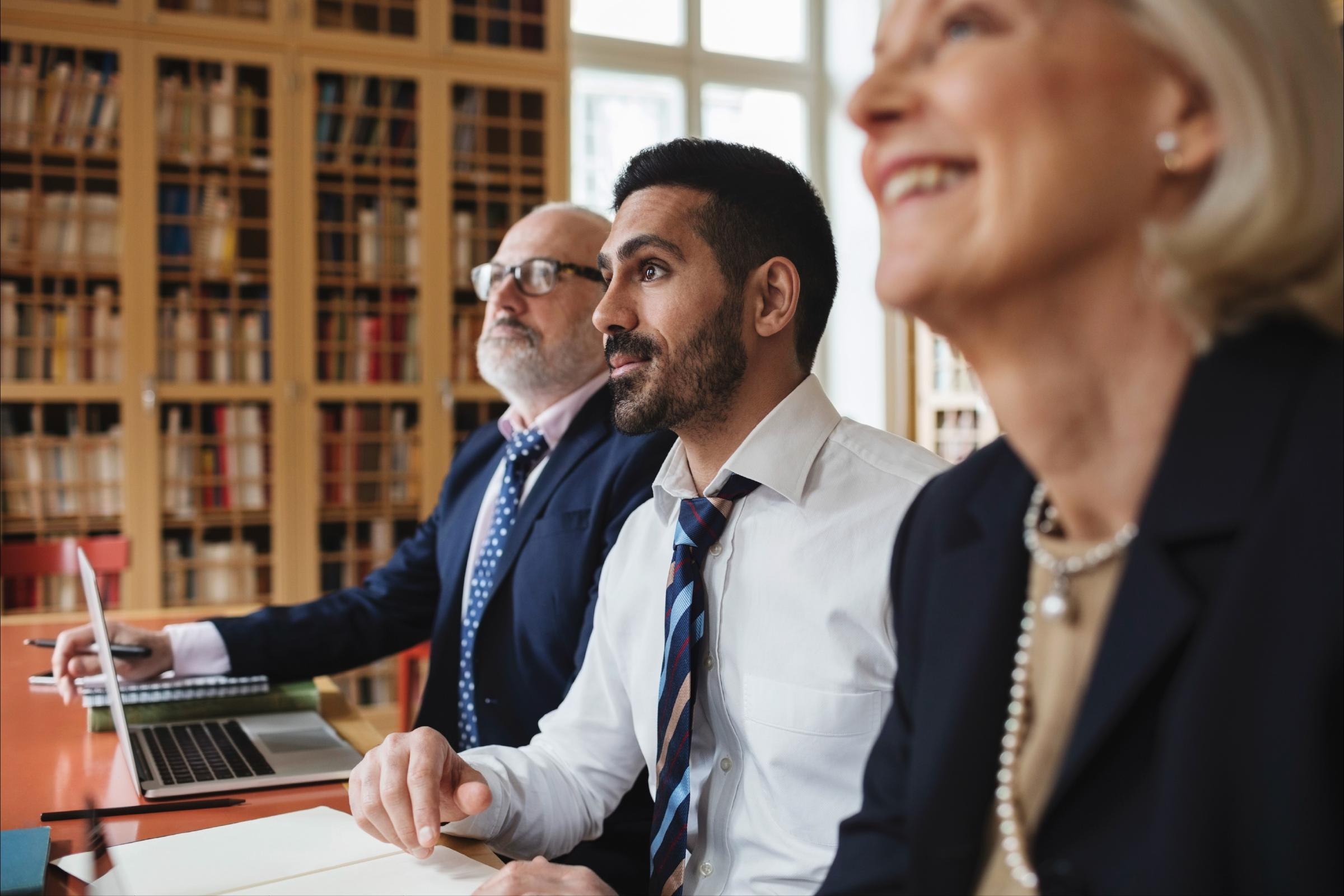 Immigration lawyers in a group meeting 