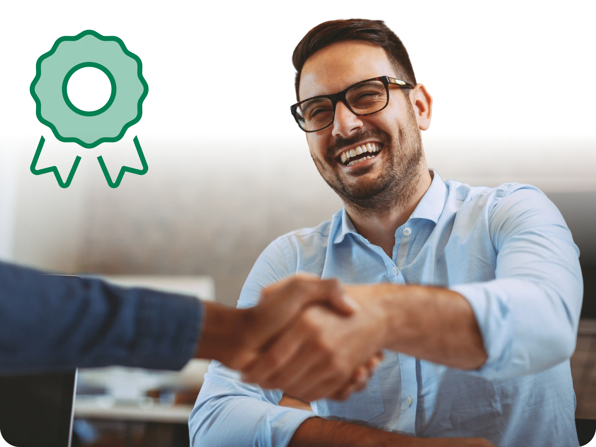 Man shaking hands with someone out of frame.