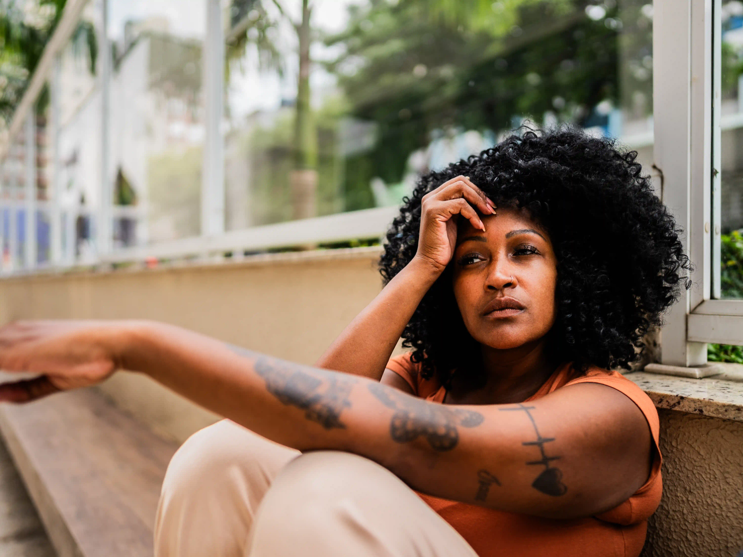 Woman with a sad expression looking into the distance 