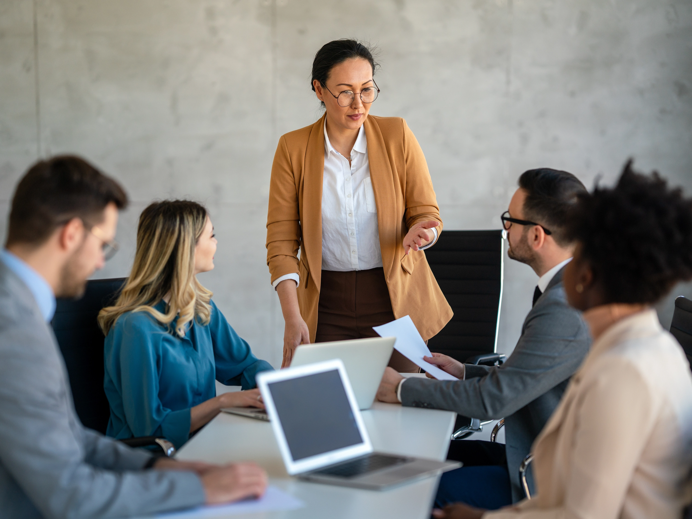 Lawyer talking to their staff during a meeting