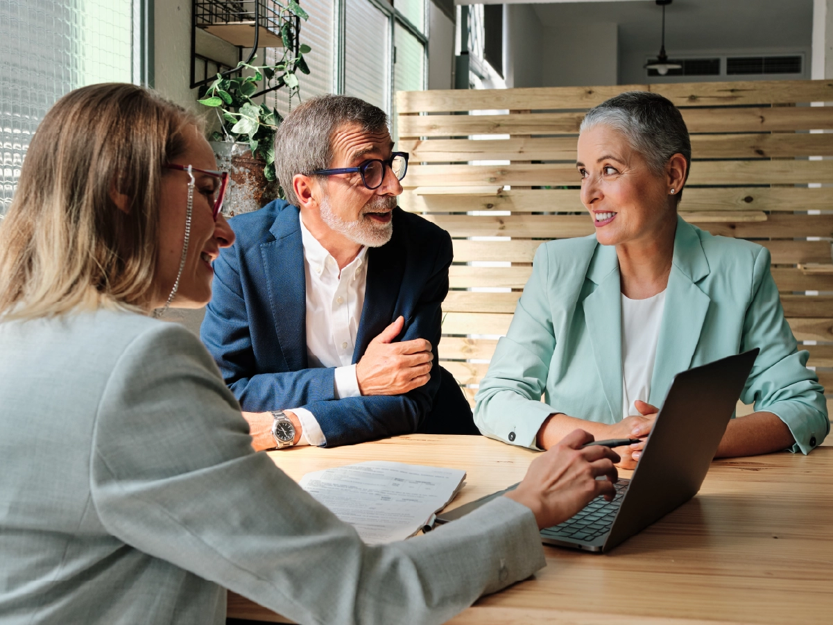Three lawyers reviewing finances on tablet