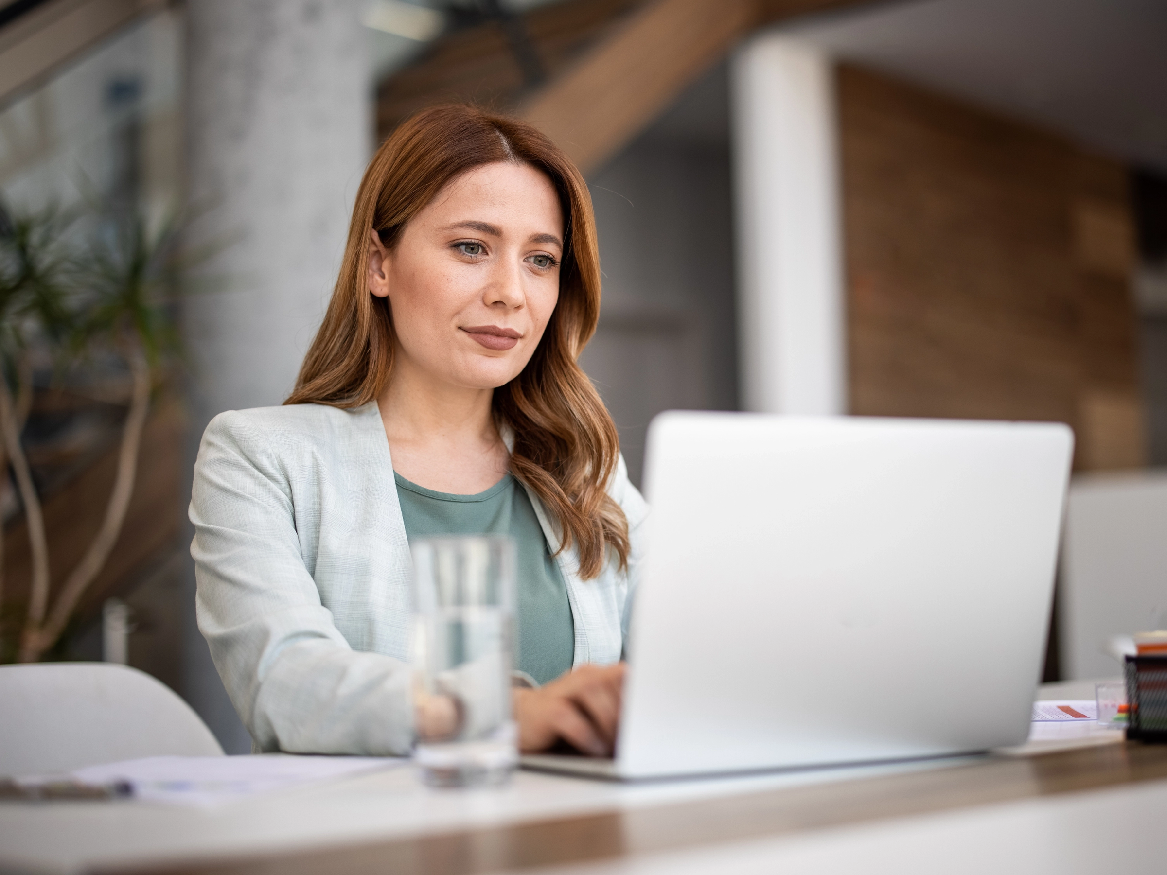Lawyer in their office looking at financial data on their computer