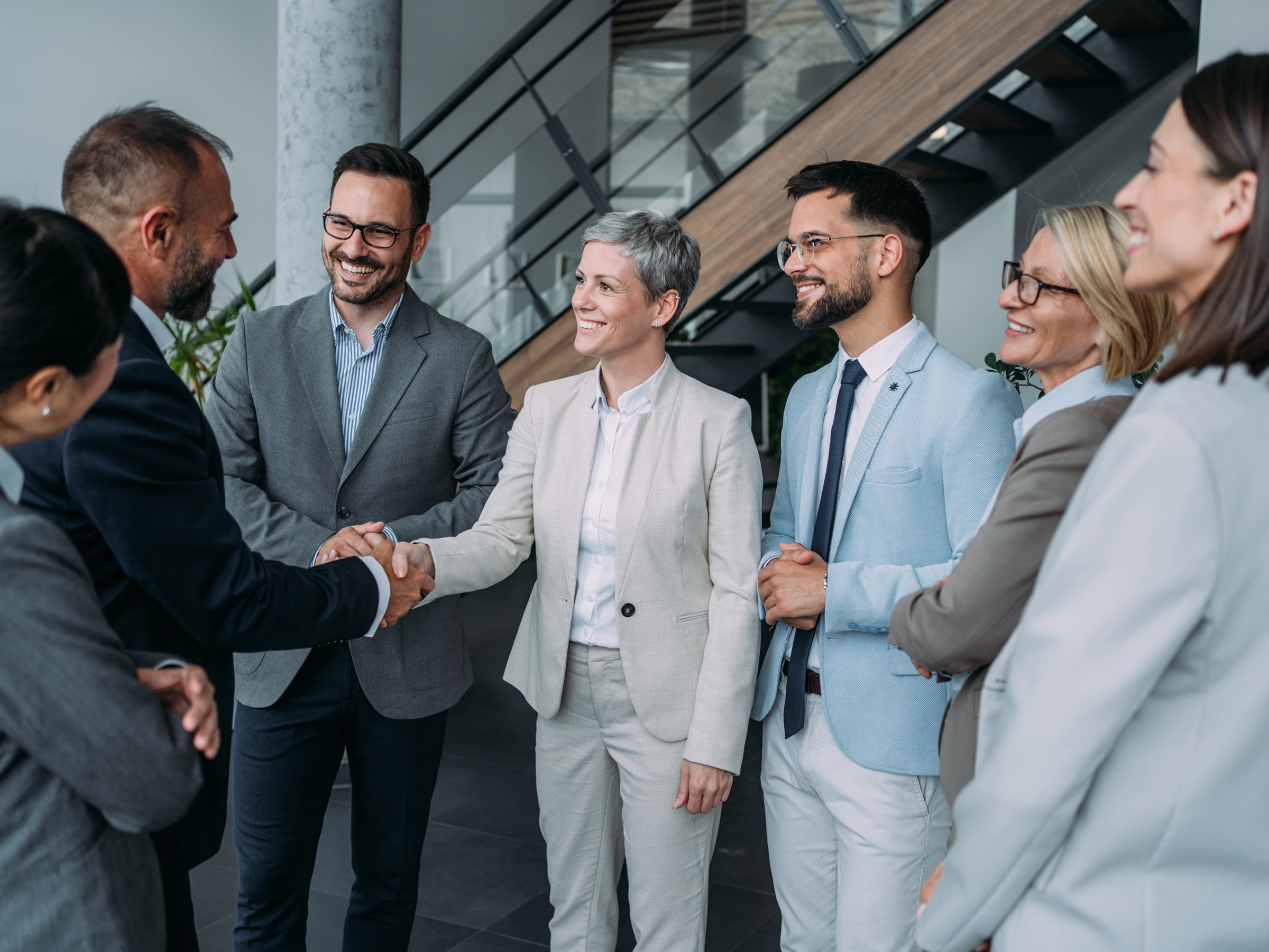 Law firm staff members meeting with a client in their office