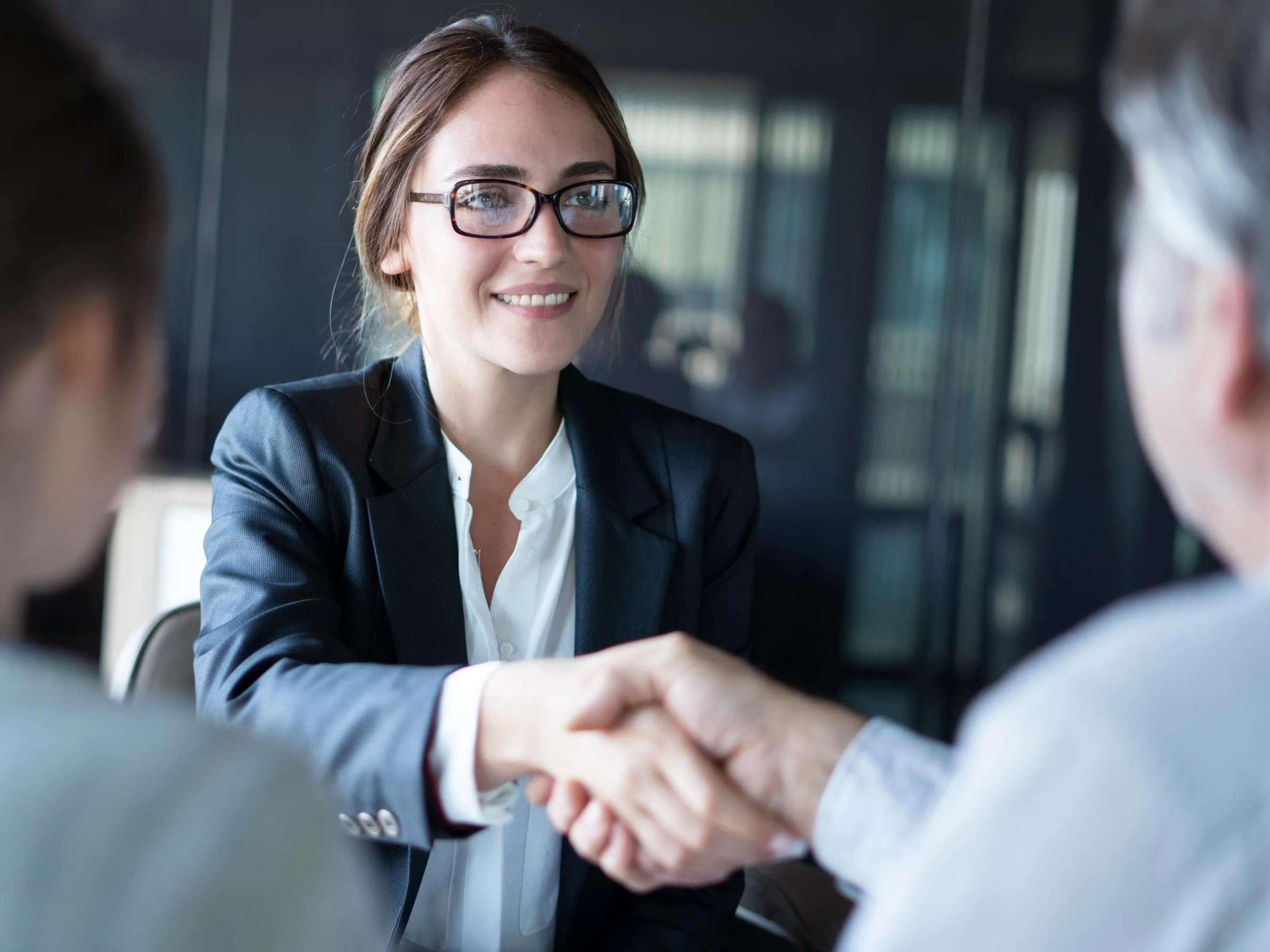 A lawyer shaking hands with a new client.