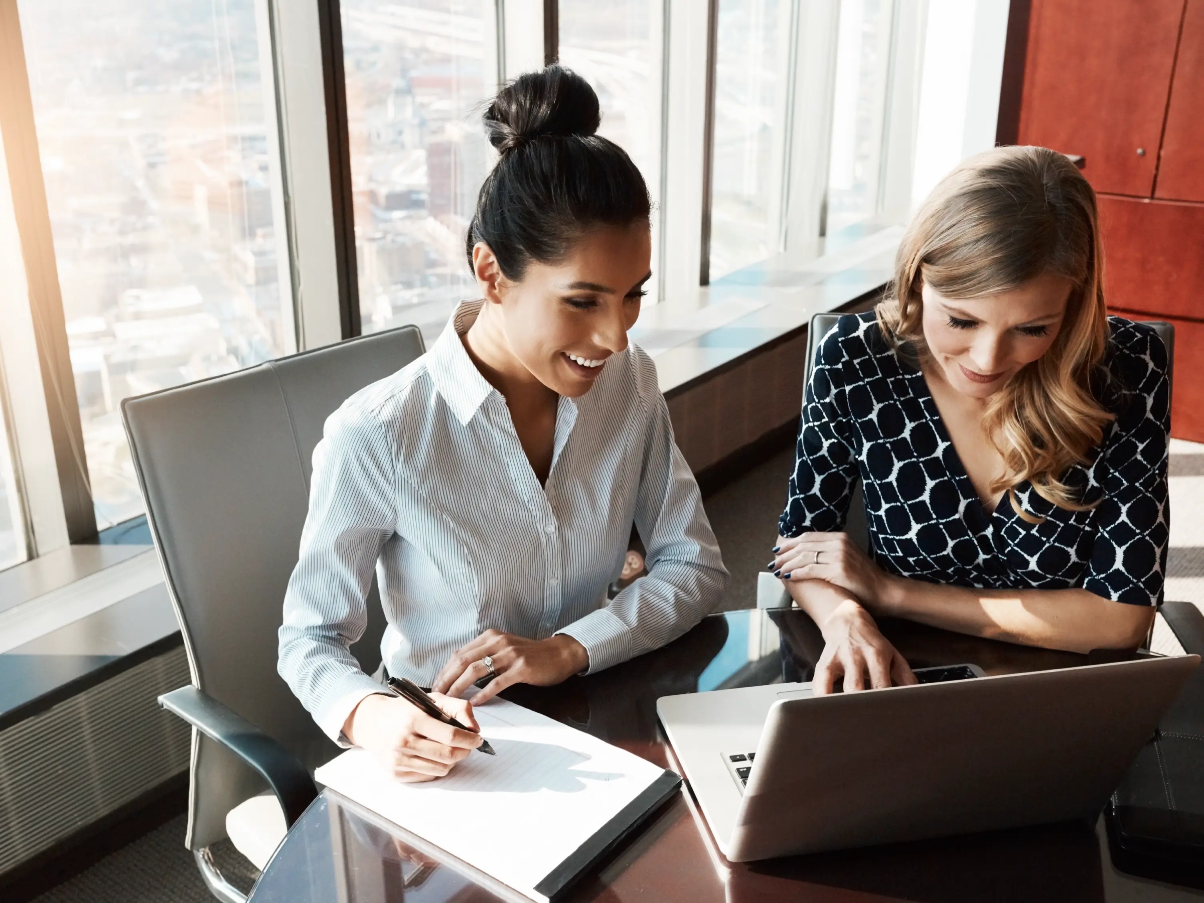 Lawyers looking at marketing data on a computer