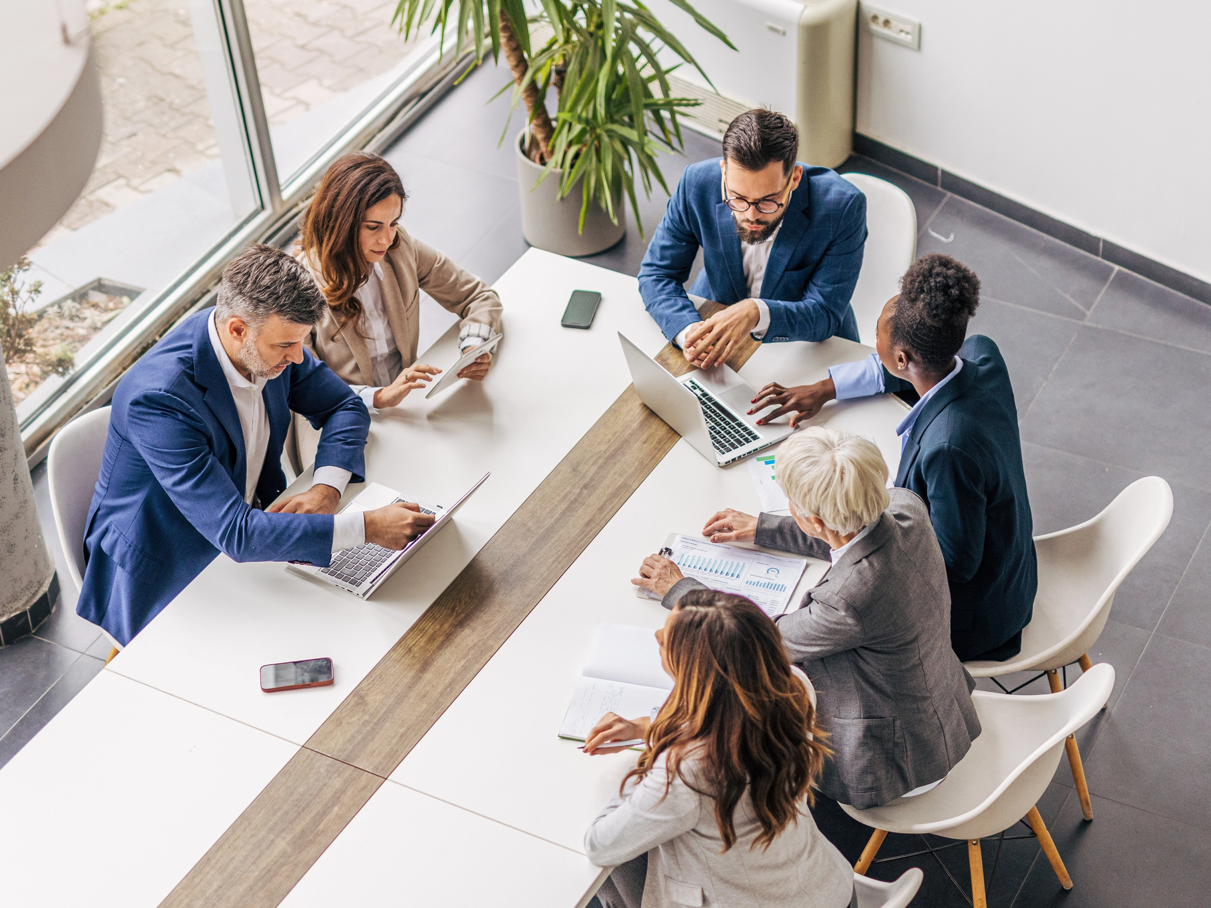 Lawyers meeting in a conference room to discuss their marketing strategy