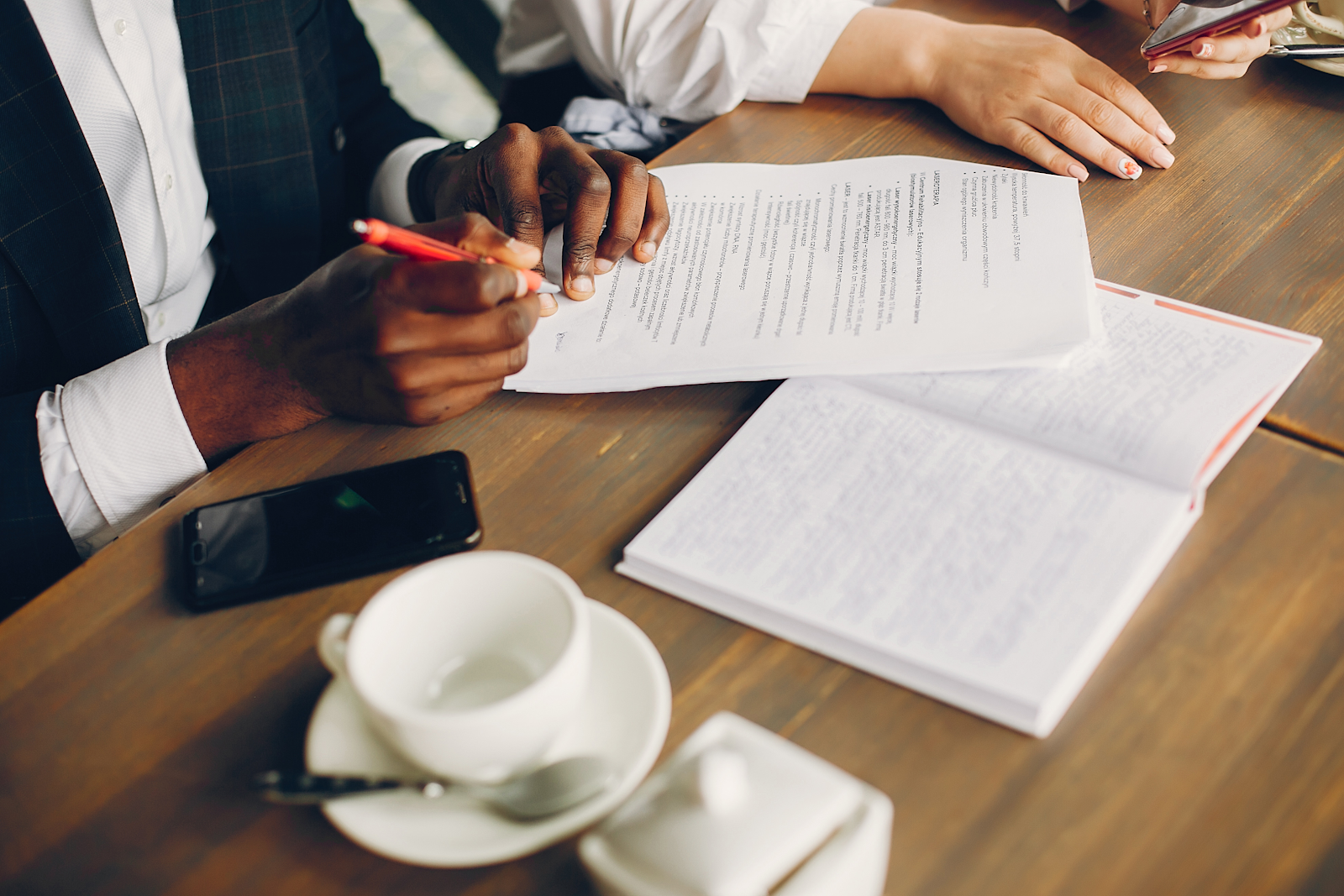 person signing a document