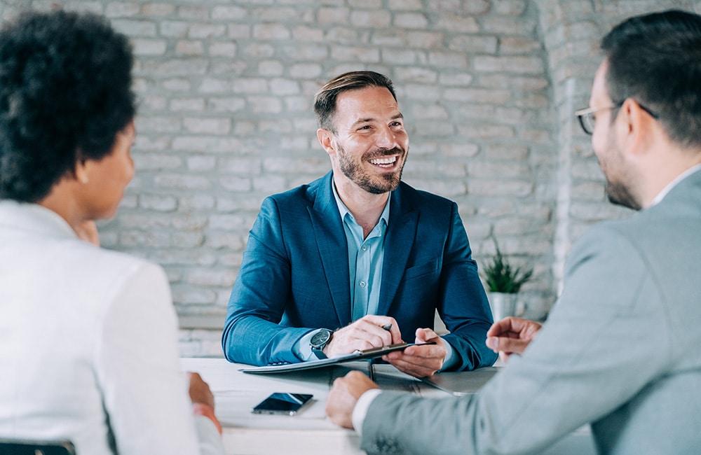 Lawyer meeting with clients in their office