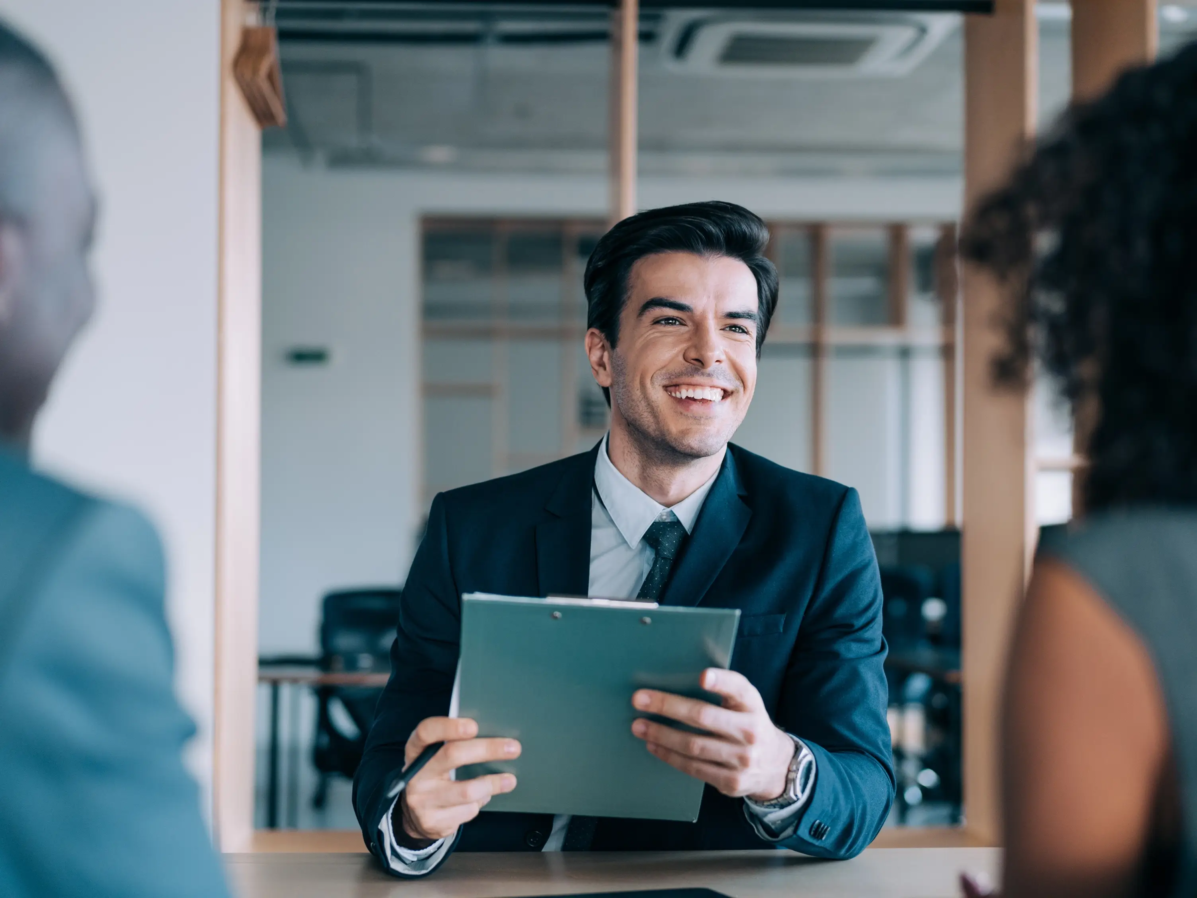 Lawyer meeting with clients in their office