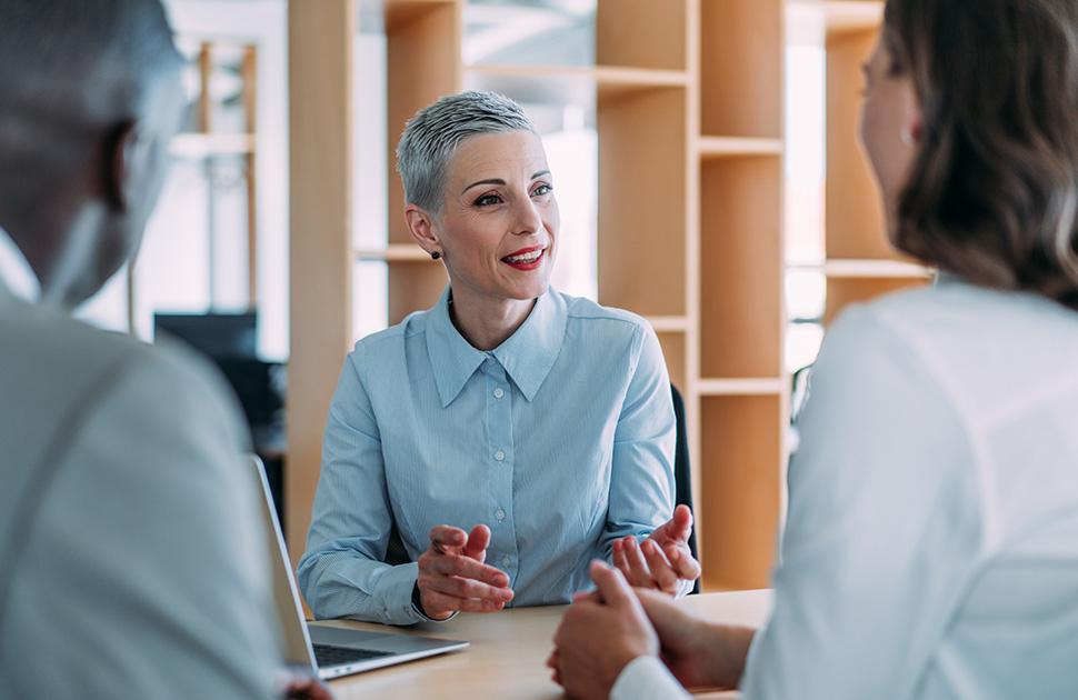 Lawyer talking to clients about their billing structure