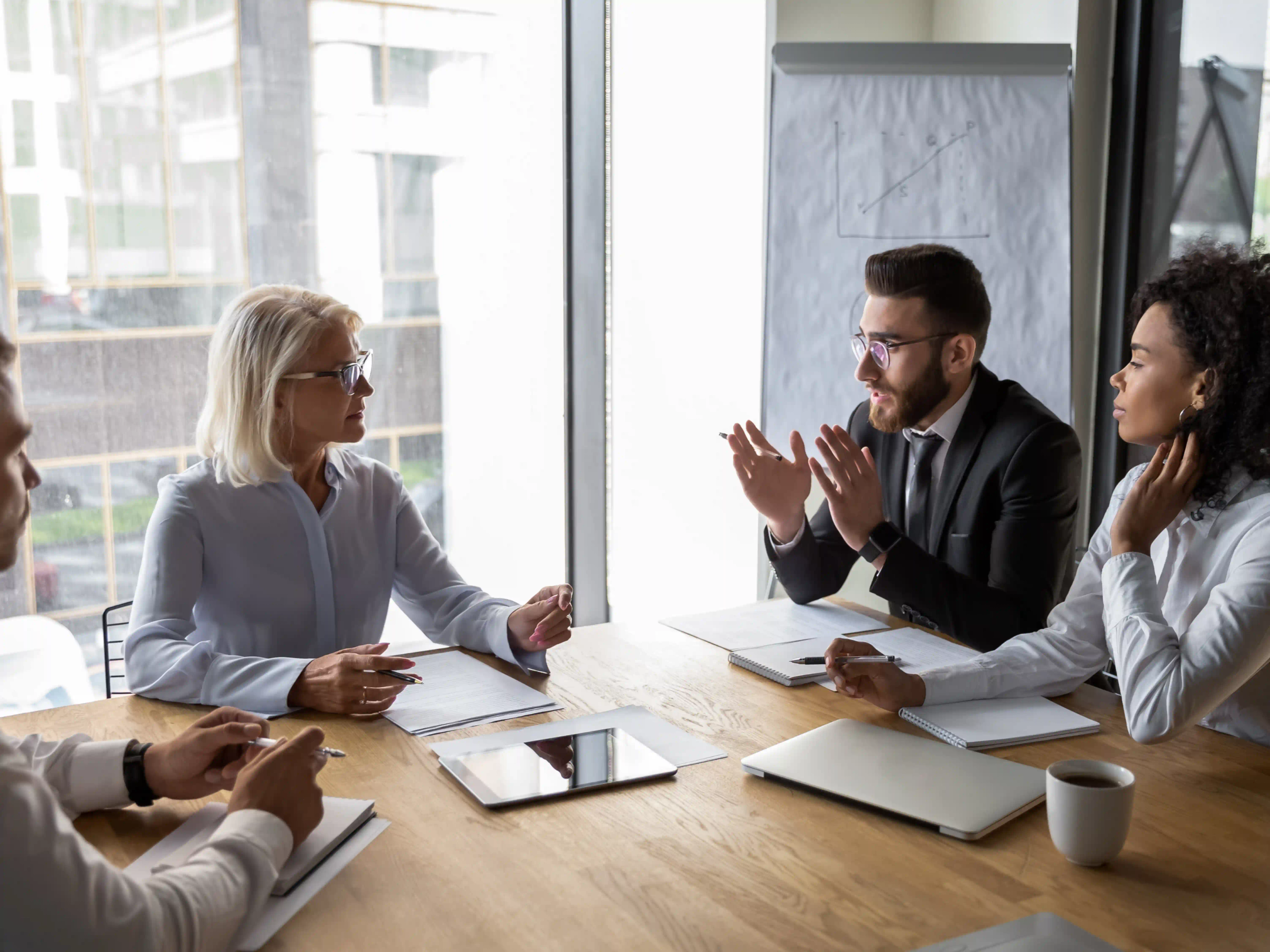 Group of legal professionals having a meeting in an office setting