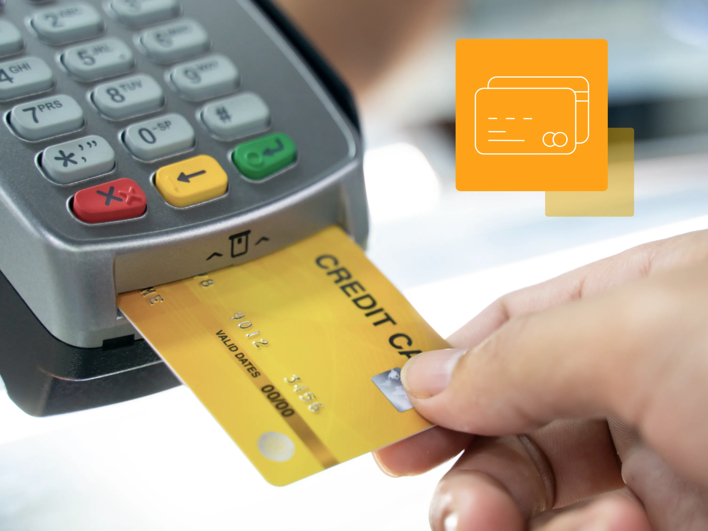 A person uses a credit card terminal to complete a purchase