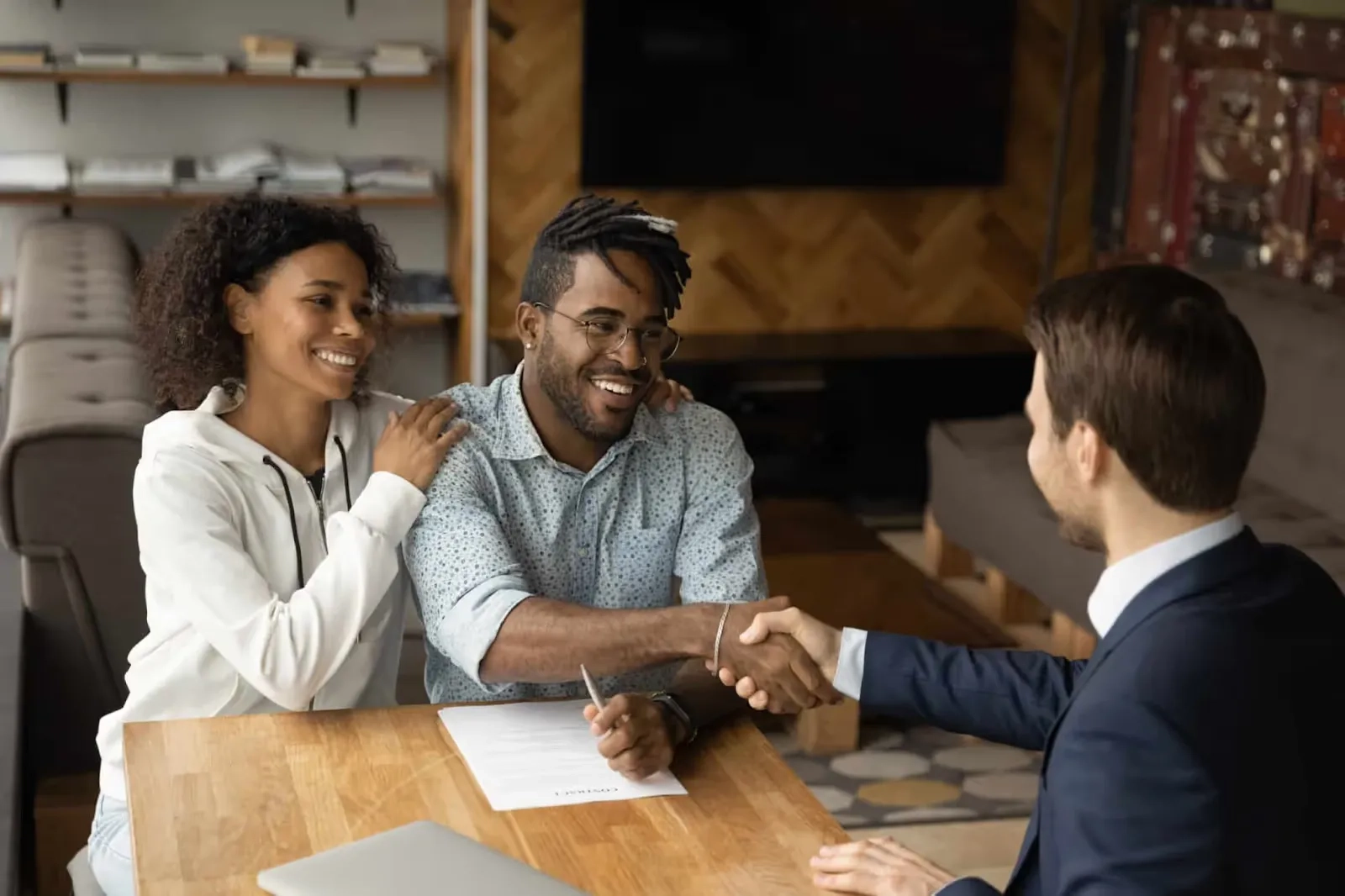 People sitting in an office and shaking hand