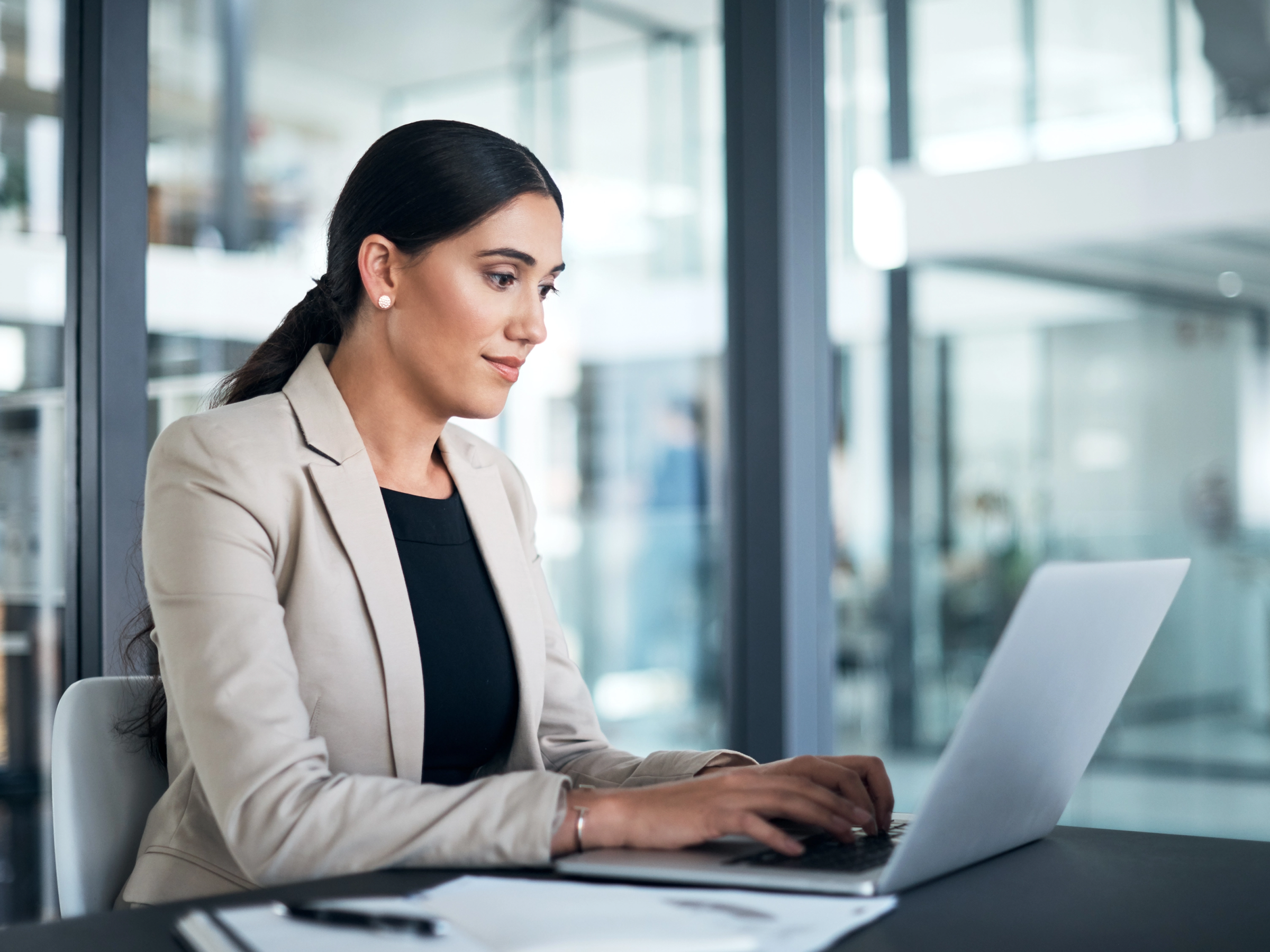 Lawyer looking at documents on a computer