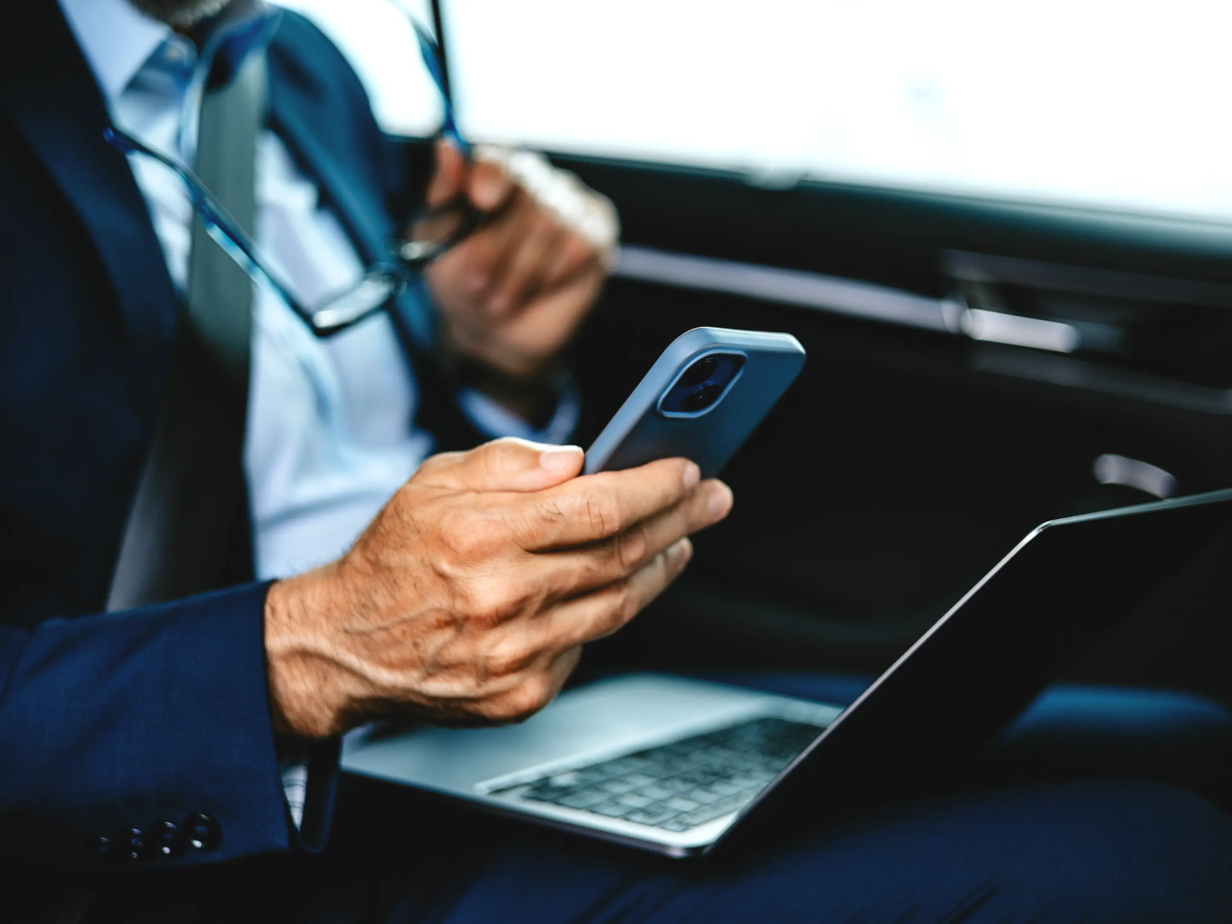 Lawyer using legal software on their phone and laptop