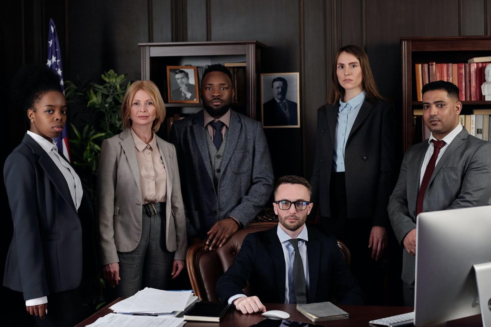 immigration lawyers around a computer