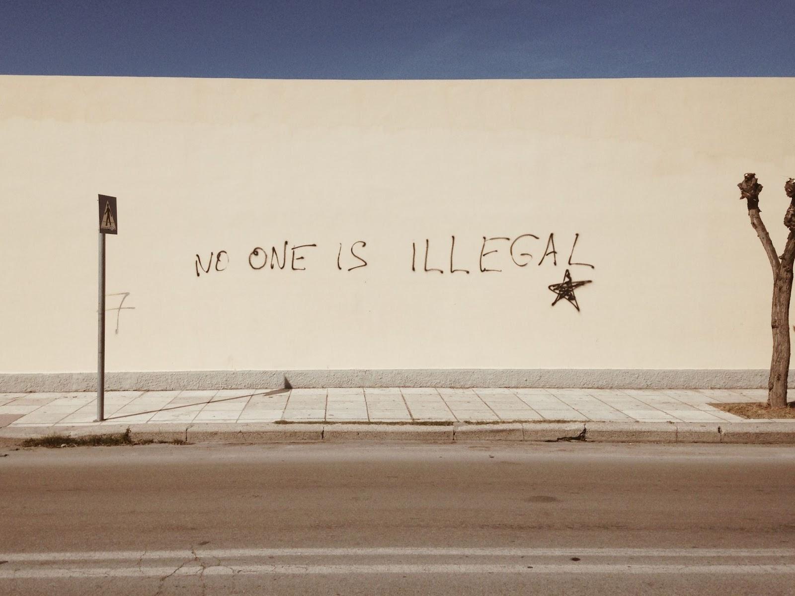 grafitti that says no one is illegal