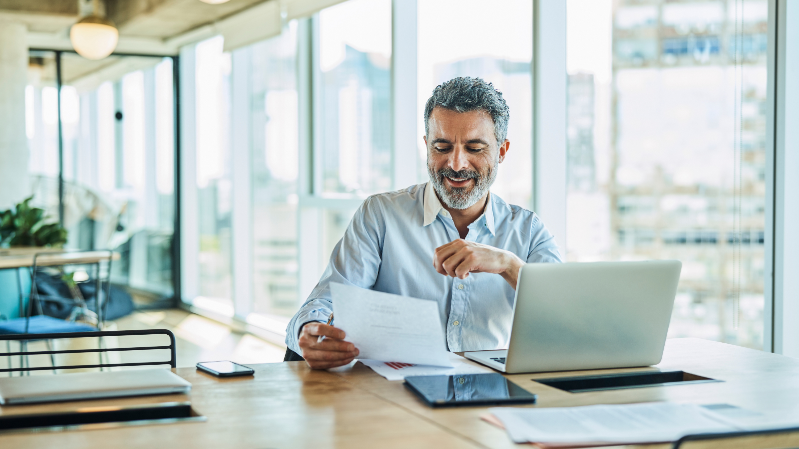 Person reviewing I-129 documents in front of computer