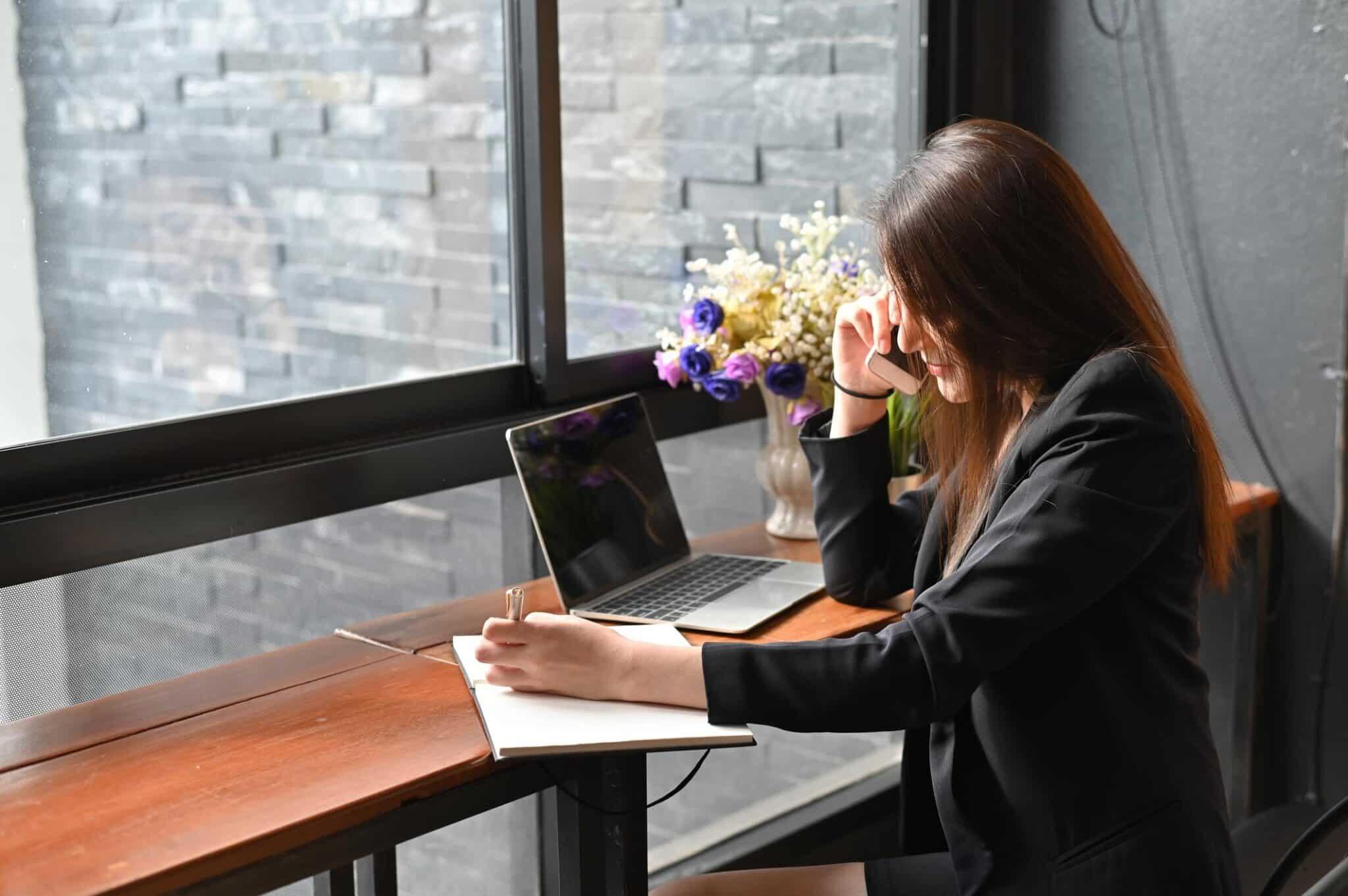Woman working with legal documents at window counter