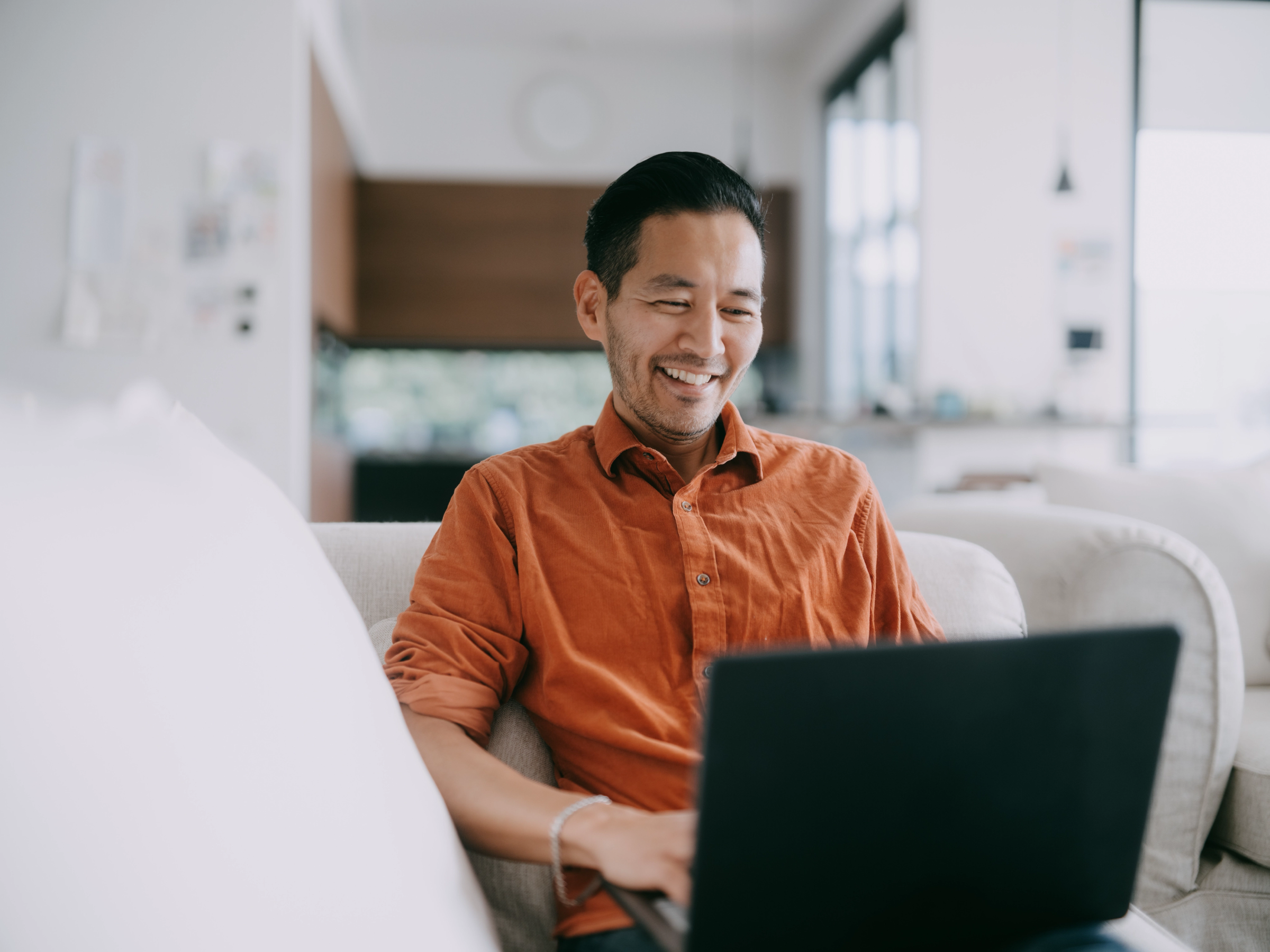 Man tracking green card application on computer