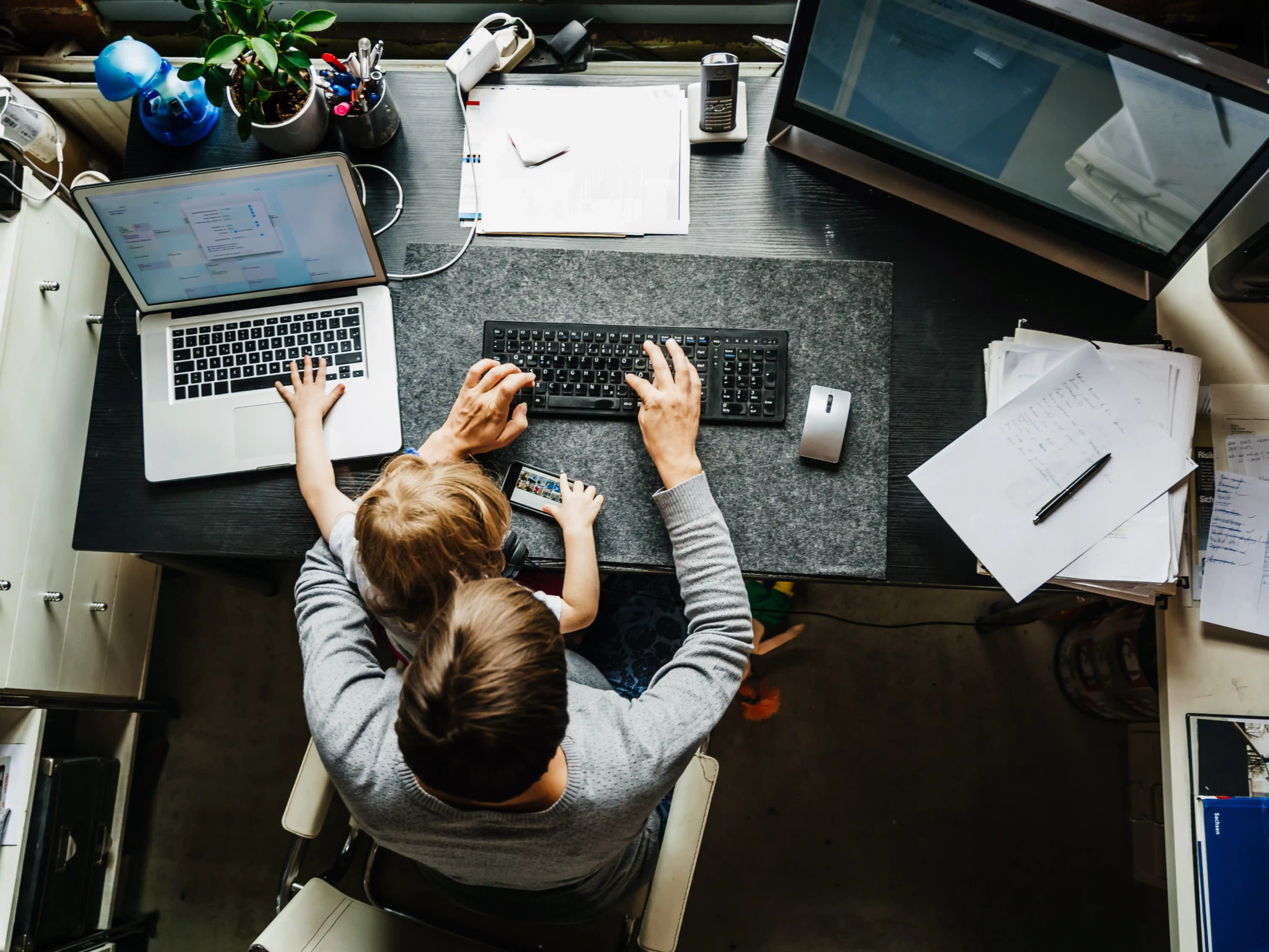 Mother working remotely with child