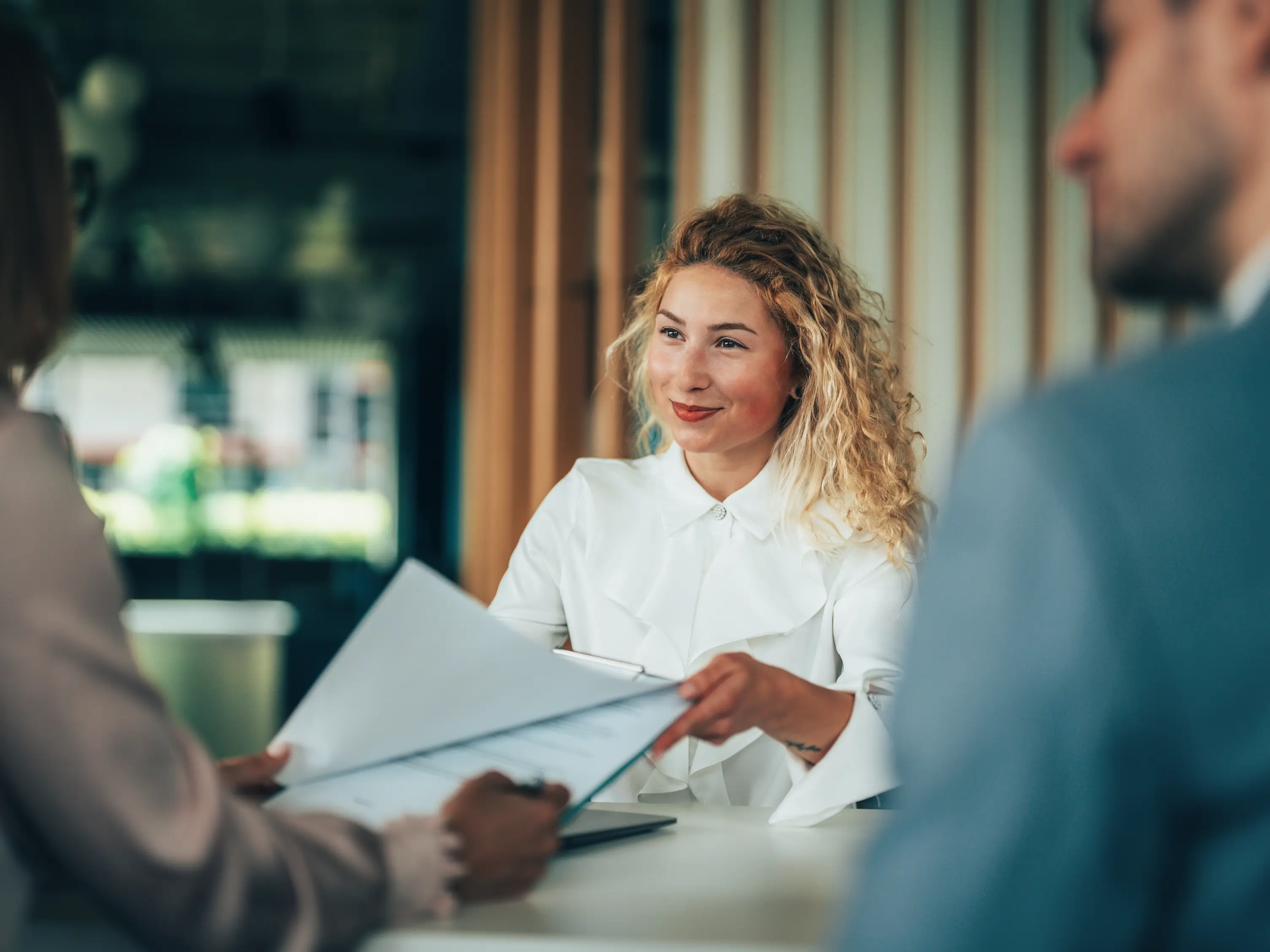 Lawyer handing a client billing-related forms
