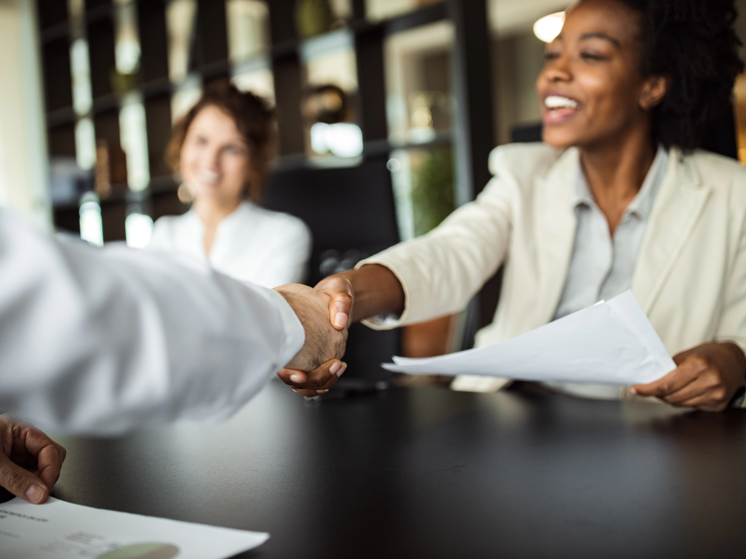 Business people shaking hands in meeting