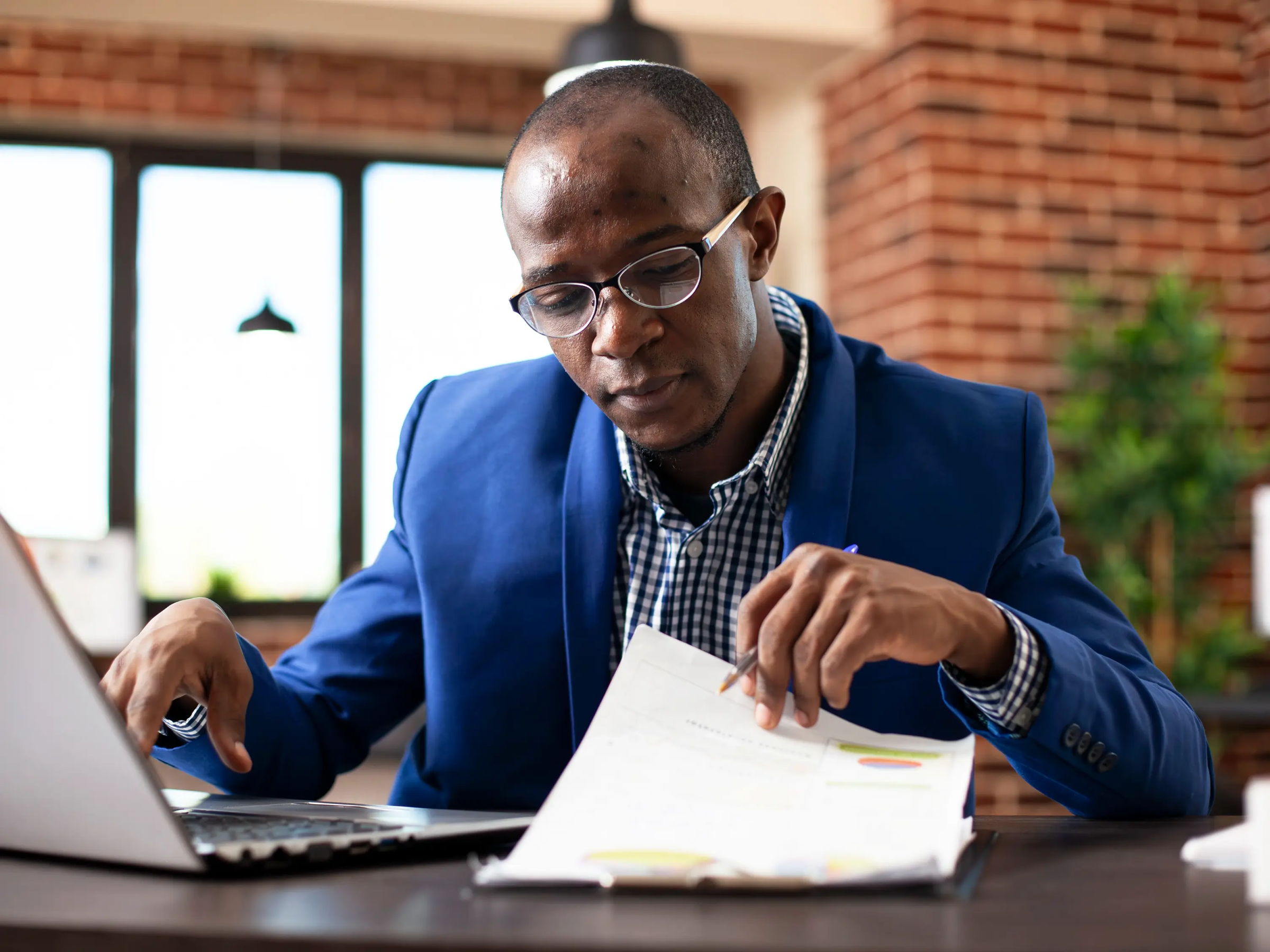 Lawyer reviewing files at their desk