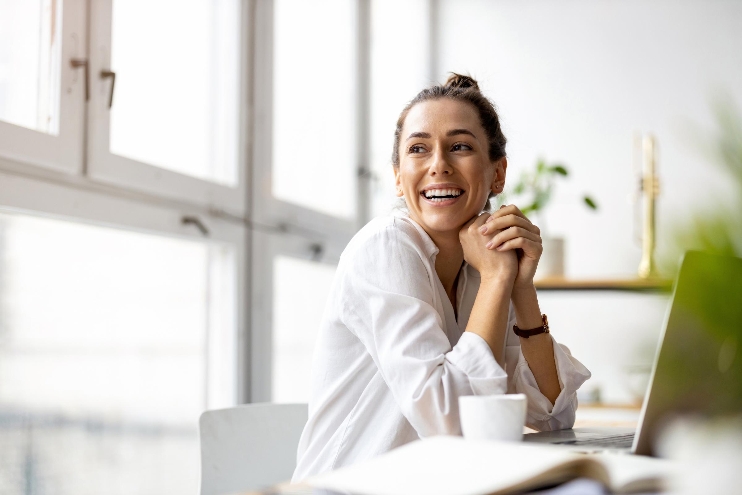 Smiling person in light room