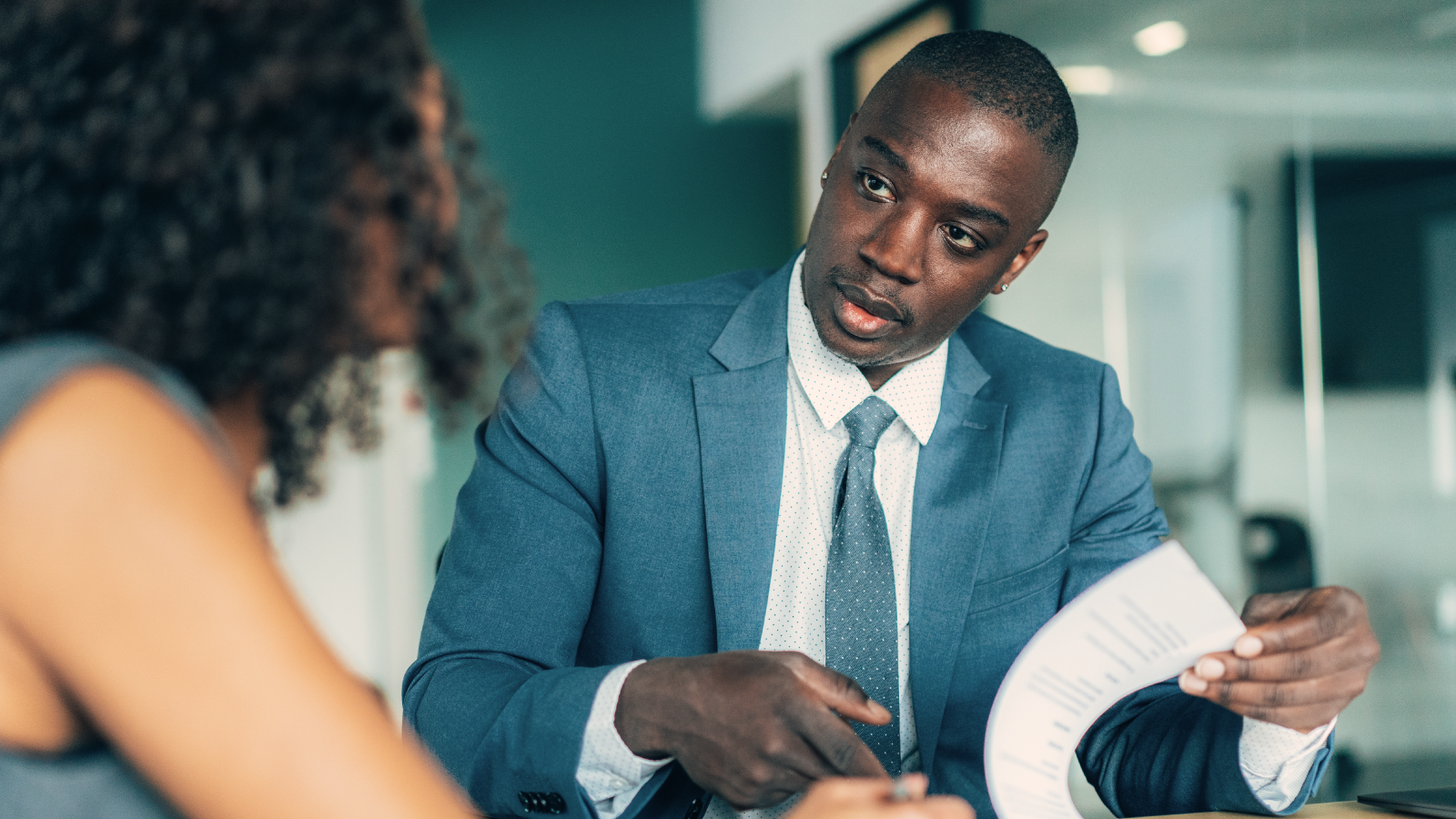 two people discussing immigration forms