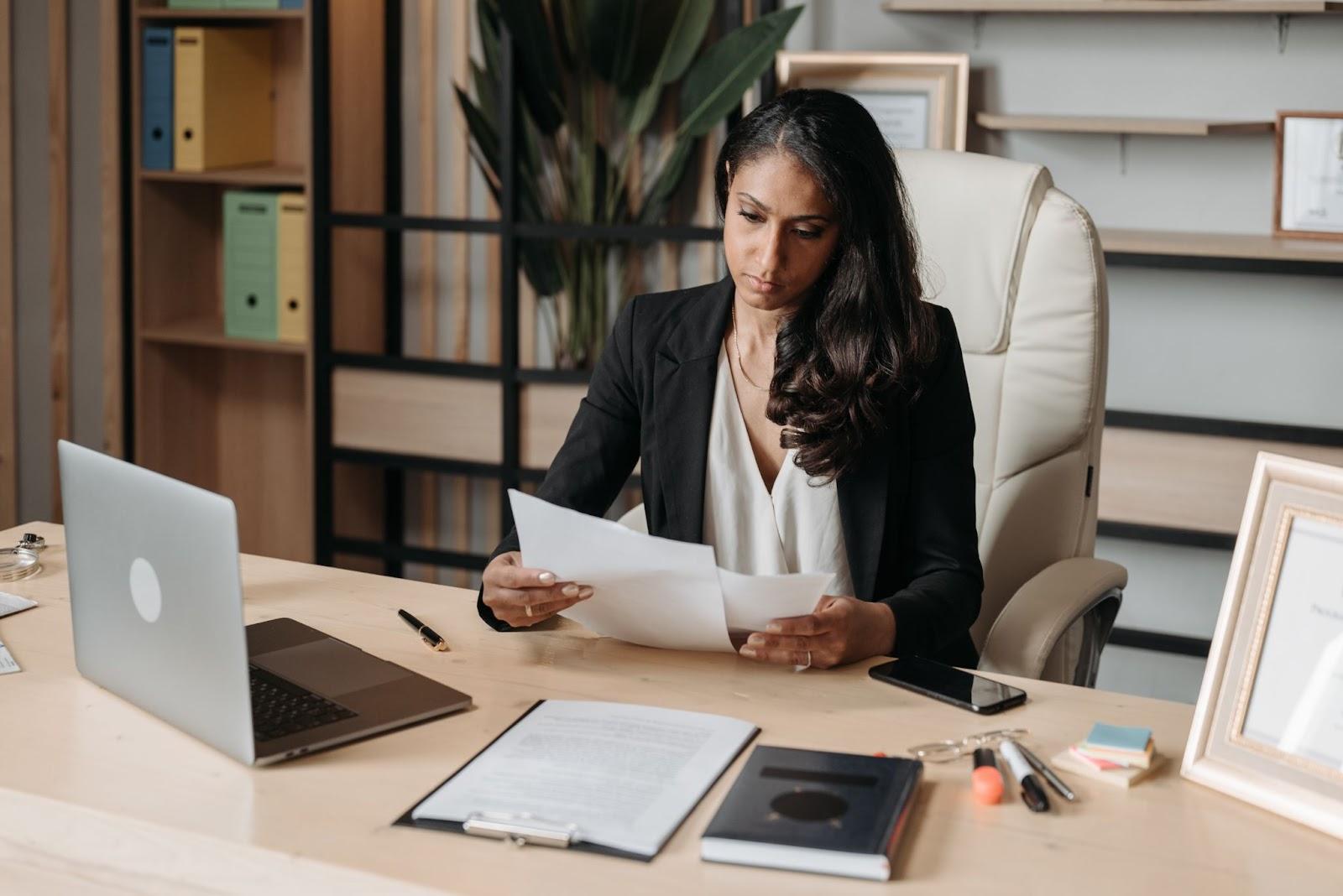 immigration lawyer reviewing documents of one of her immigration clients