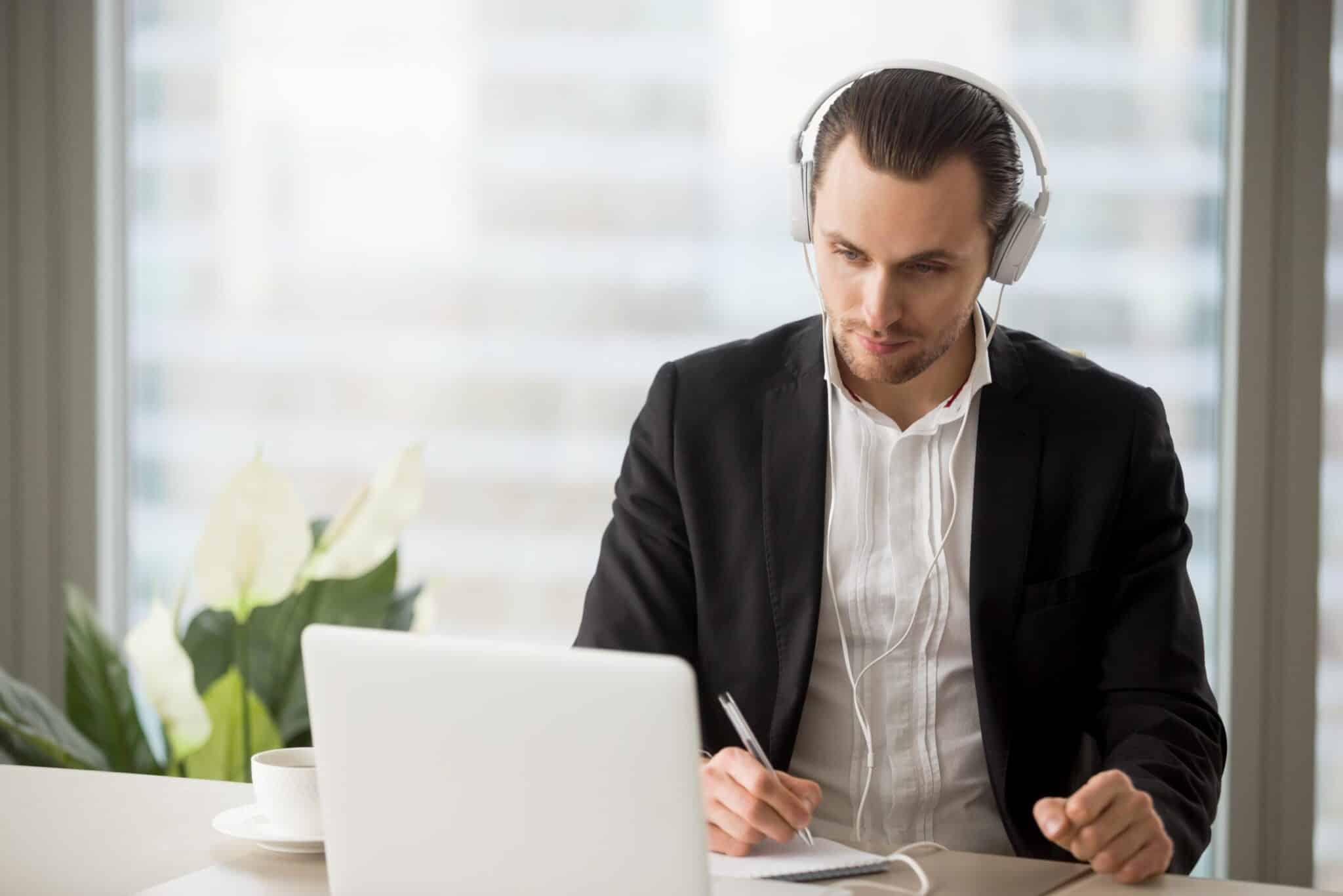 Lawyer working on case with laptop and headphones