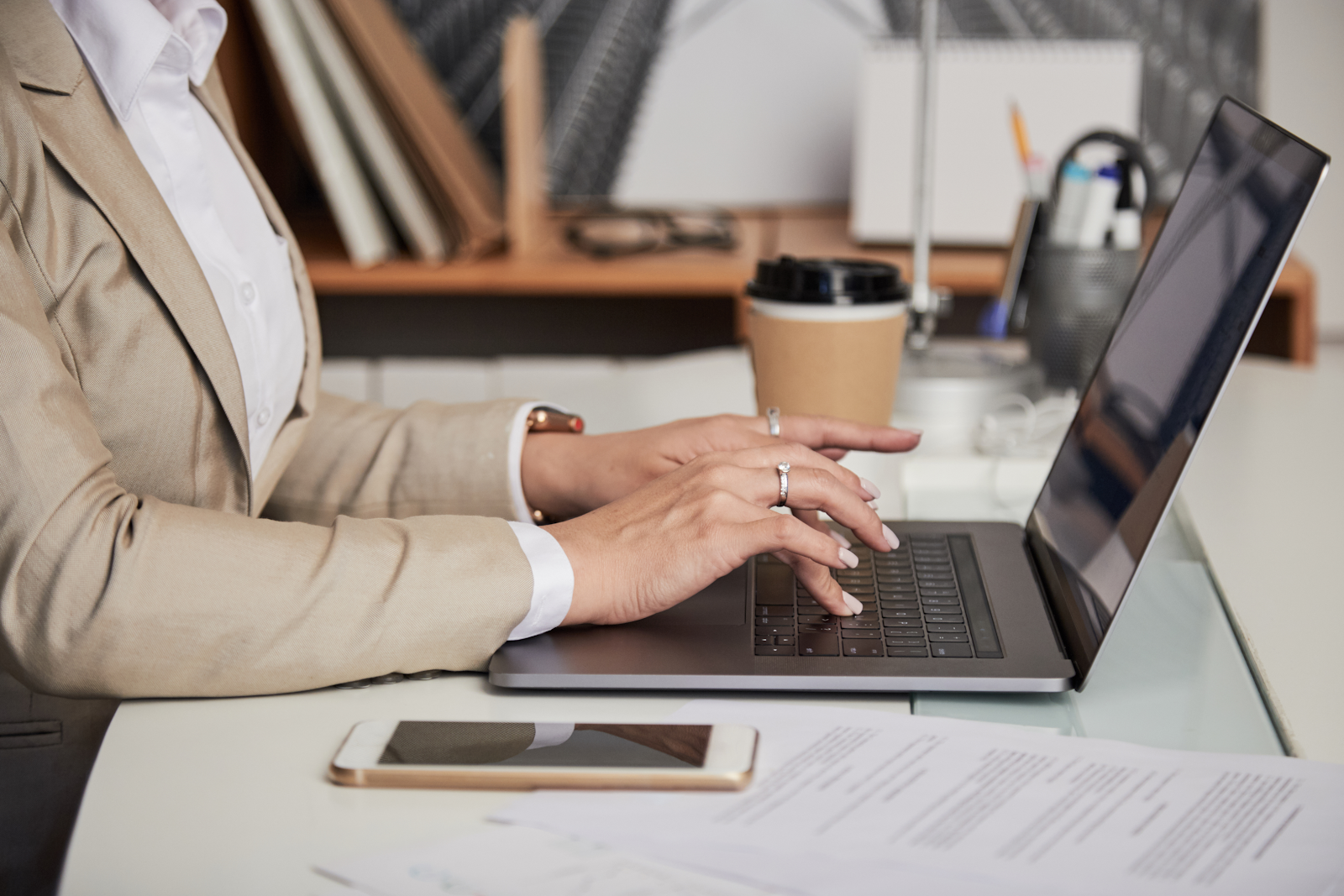 person typing on a lap top