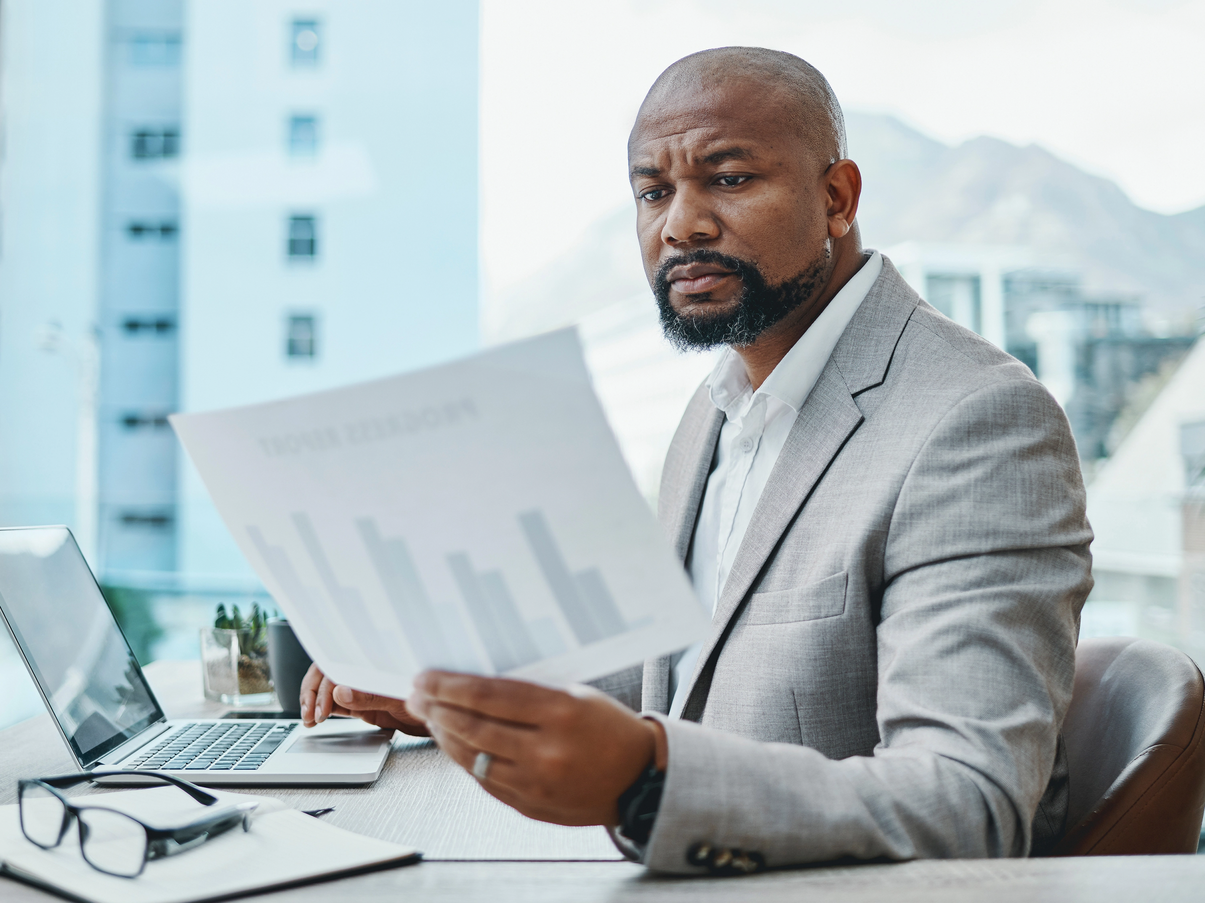 A lawyer reviewing data and analytics