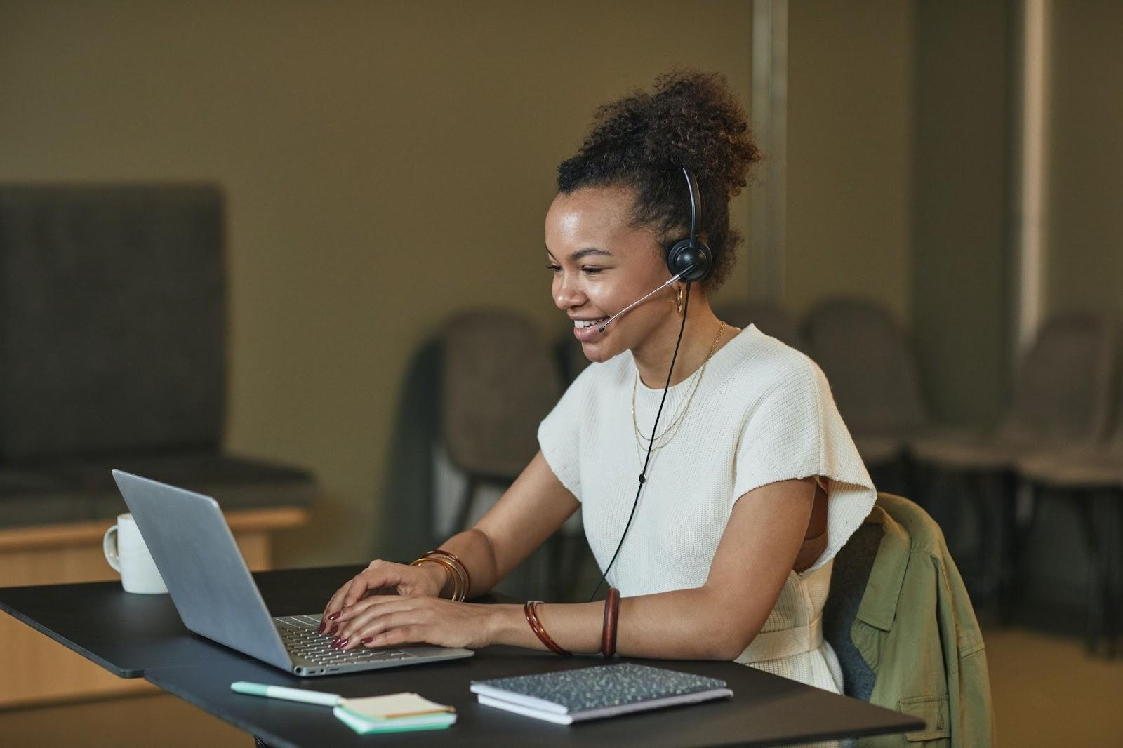 paralegal inputting immigration client information into her firm's case management software