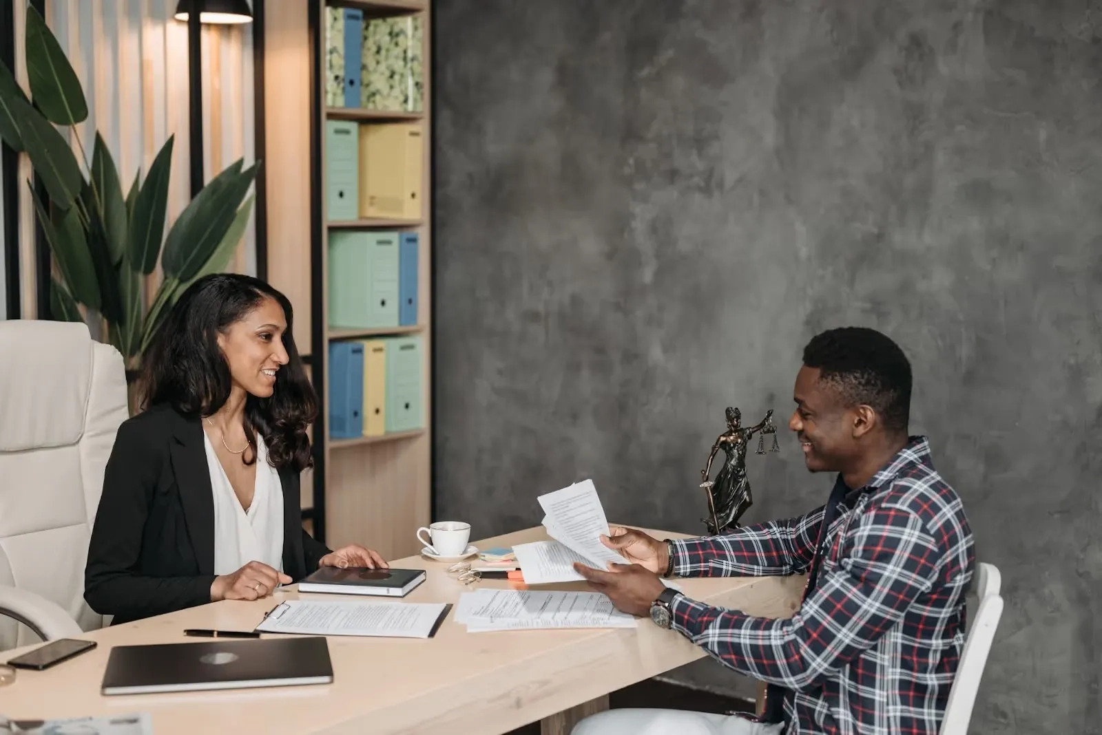 lawyer having a client meeting and discussing the case at hand