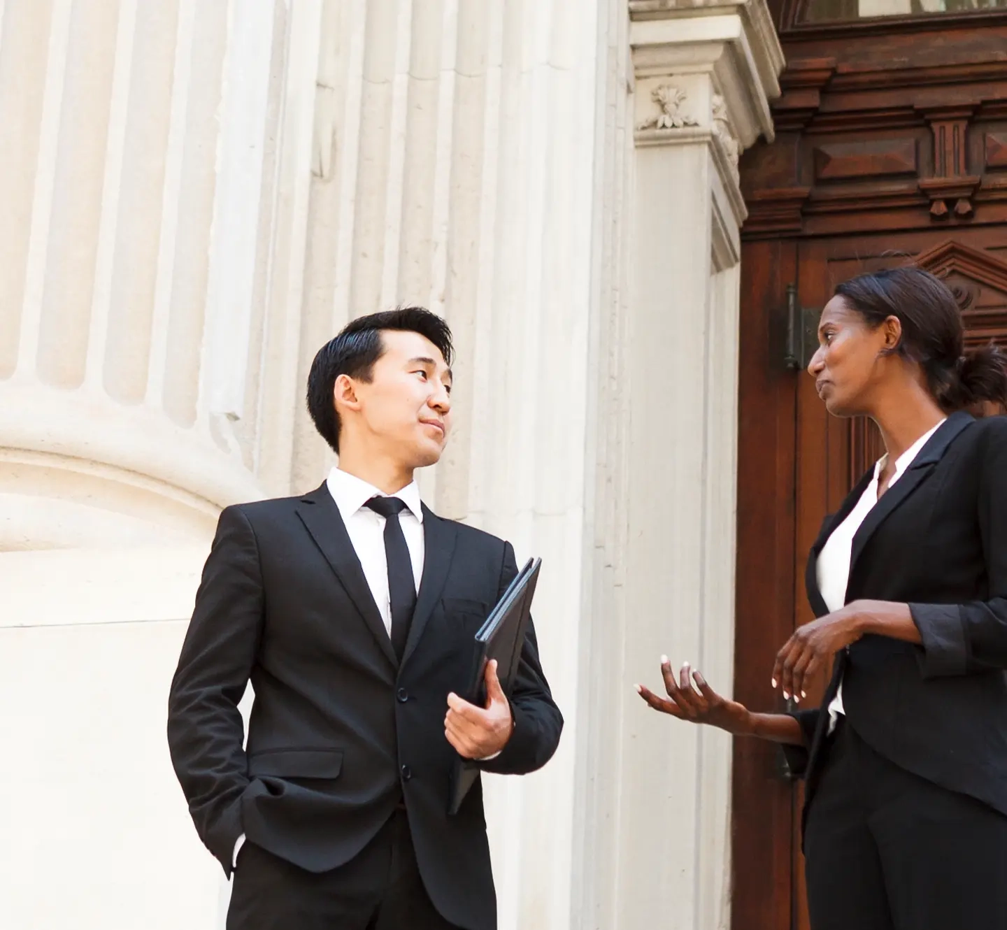 Two lawyers discussing case