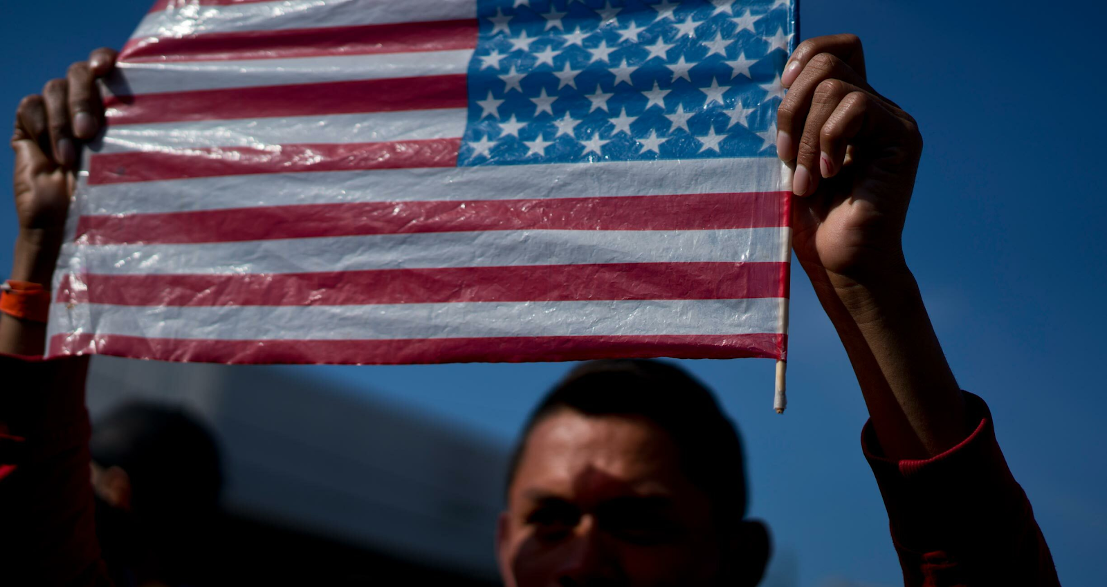 A person holding the American flag