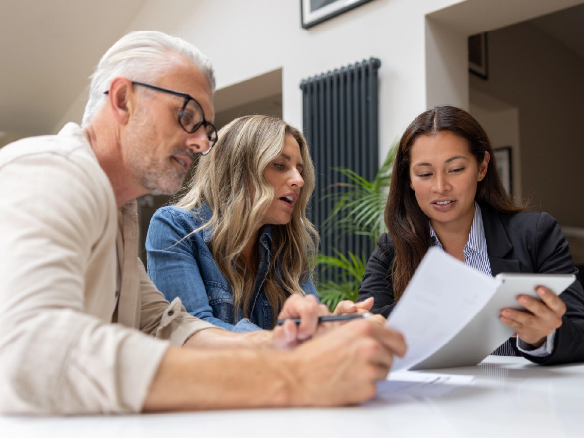 Couple reviewing USCIS payments with immigration lawyer