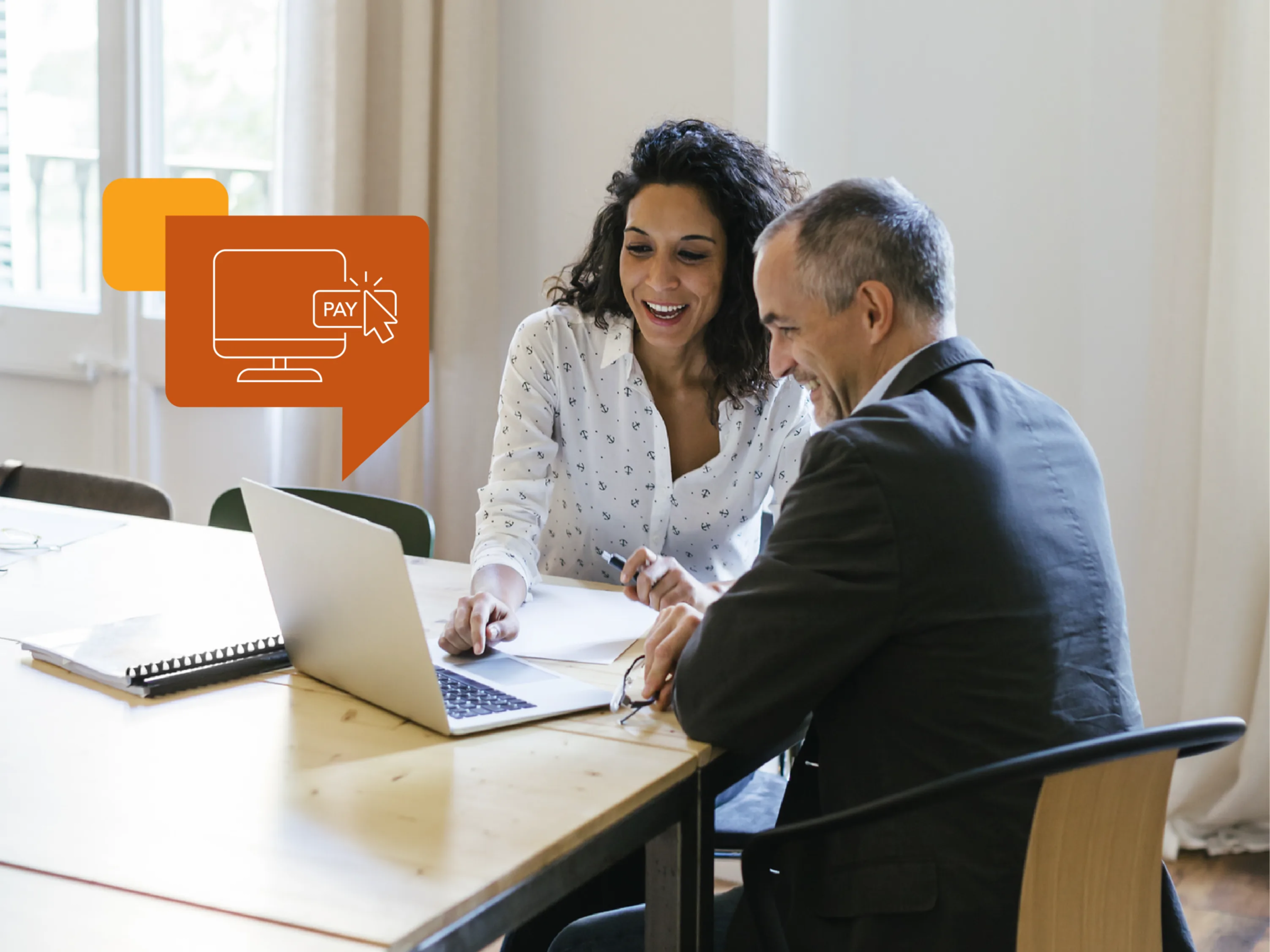 Two coworkers check their account online