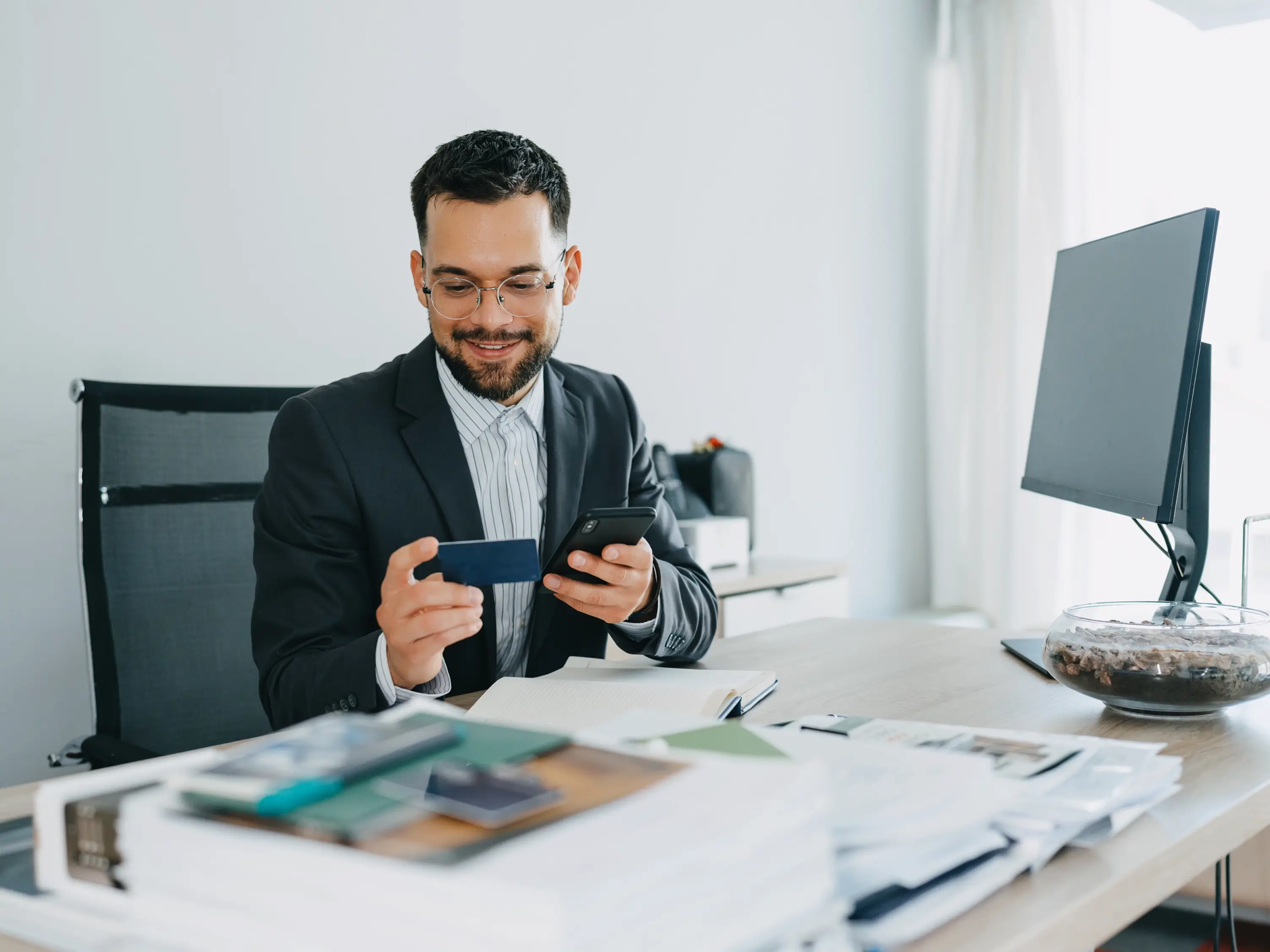 Lawyer handling a credit card in their office