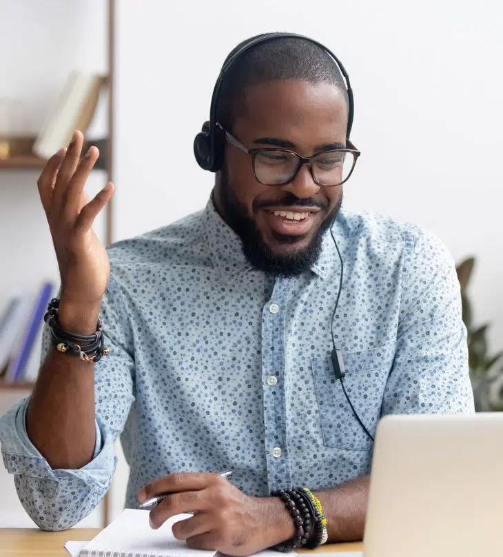 Man smiling at laptop