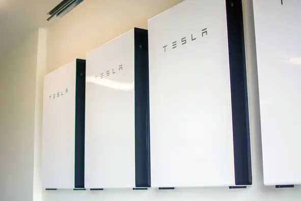 Tesla powerwall batteries installed on a wall