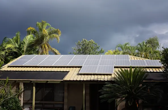 Stormy weather and house with solar panels