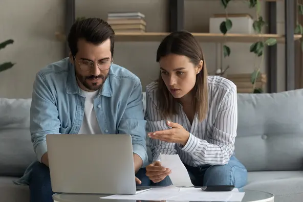 couple researching solar panels and solar roof tiles