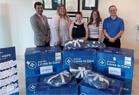 Mike Barkema, Assistant Vice President, UVA Health Prince William, Michelle Strider, Chief Nurse Operating Officer, UVA Health Prince William, Maggie Chamberlain, Campaign Development Manager, Leukemia and Lymphoma Society; Megan McDuffie, General Manager, Subaru of Sterling, and Andrew Raszewski, Subaru District Sales Manager for Northern Virginia
